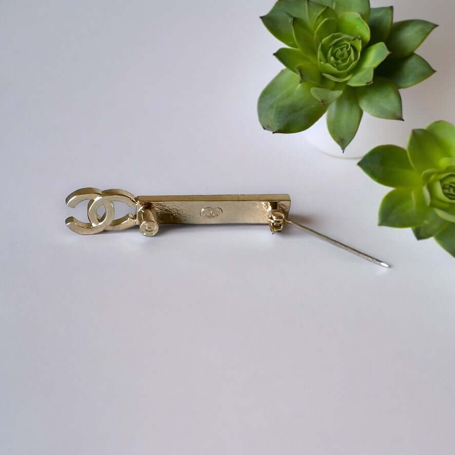 Chanel Lighter Gold Double C Engraved CHANEL Brooch PinThis Chanel brooch pin is a timeless accessory, featuring a lighter gold finish and double C design. With the CHANEL engraving, it exudes elegance and sophistication. Its smaller size makes it versati My Mama Found What 
