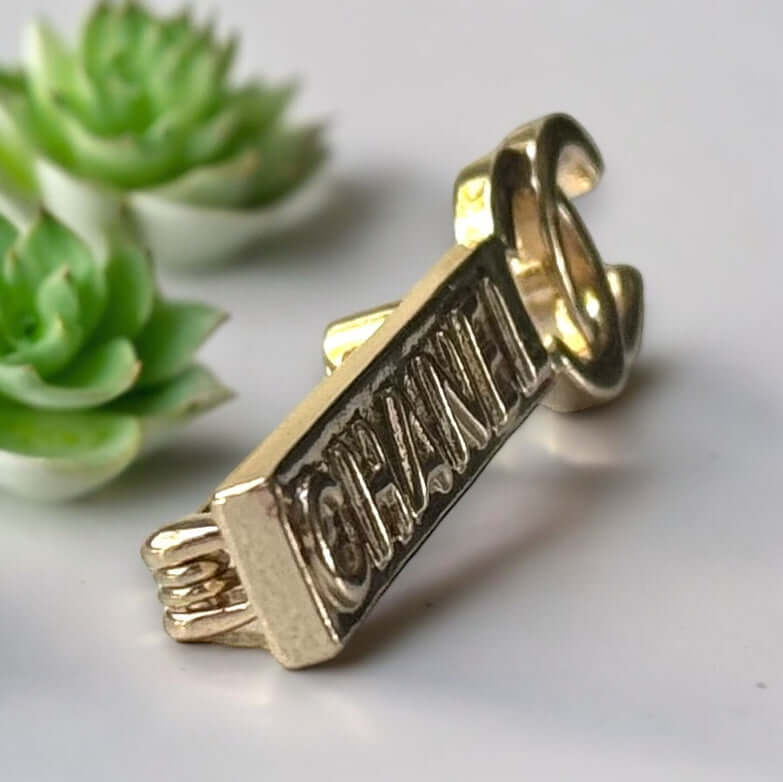 Chanel Lighter Gold Double C Engraved CHANEL Brooch PinThis Chanel brooch pin is a timeless accessory, featuring a lighter gold finish and double C design. With the CHANEL engraving, it exudes elegance and sophistication. Its smaller size makes it versati My Mama Found What 