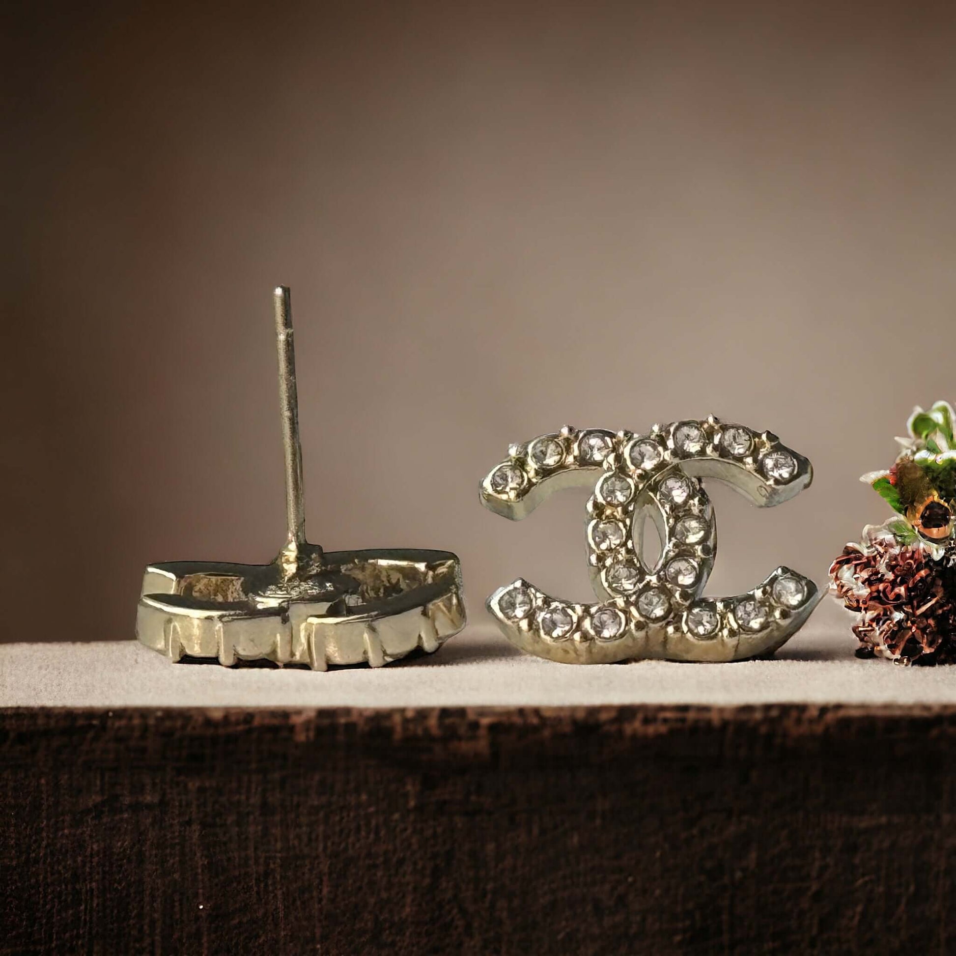 Chanel Lighter Gold Smaller Double C with round clear crystals earringsAccessorize with these lightweight Chanel Gold Double C earrings, featuring clear round crystals that add subtle sparkle to any outfit. Versatile for any occasion, these elegant earrin