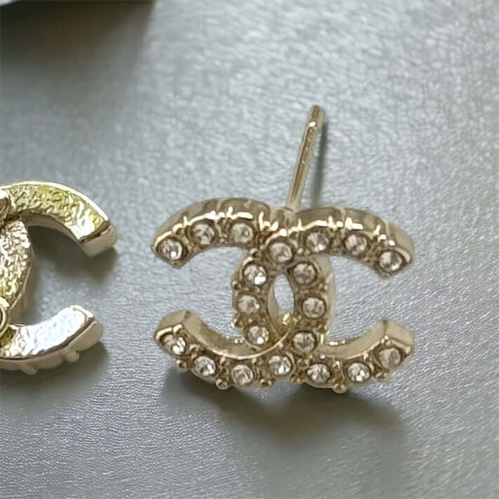 Chanel Lighter Gold Smaller Double C with round clear crystals earringsAccessorize with these lightweight Chanel Gold Double C earrings, featuring clear round crystals that add subtle sparkle to any outfit. Versatile for any occasion, these elegant earrin My Mama Found What 