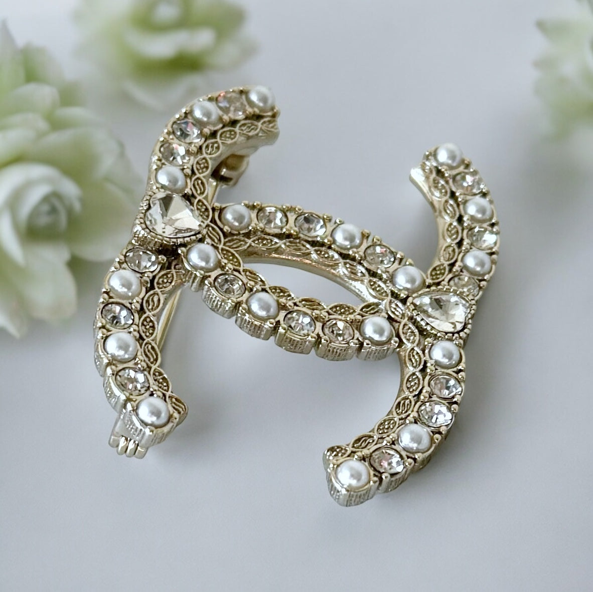 Chanel Paler Gold Double C Pearls Crystals Dressy BroochRare Style Like New Gorgeous Chanel Paler Gold Double C Pearls & Crystals Has a heart like shaped crystal in the center of both top and bottom . Faux Pearls Clear Crystals Strass Gold Plated Comes wi My Mama Found What 
