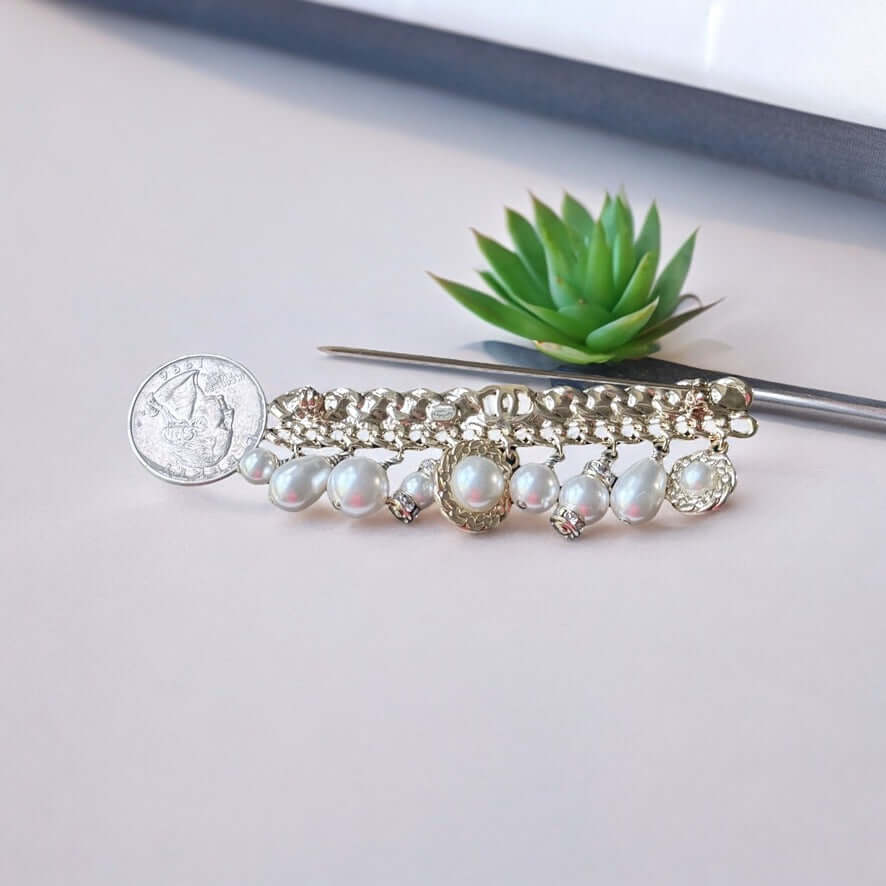 Chanel Rare Lighter Gold Long with Various Dangling Charms Brooch Pin 21 PIntroducing an elegant and rare brooch from Chanel, the Rare Lighter Gold Long Brooch with Various Dangling Charms! Accented with faux pearls and crystals, this brooch features a mi My Mama Found What 