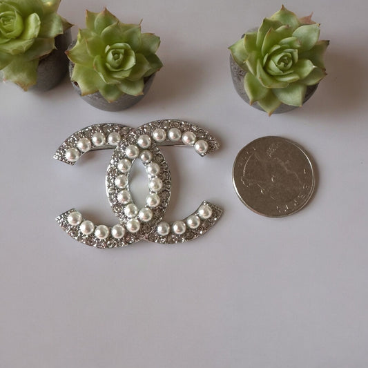 Chanel Silver Double C Brooch With Pearls & Crystals PinClassic , Clean Lines , minimalistic , elegant yet updated on trend Purchased at an Estate Sale Silver Double C with (faux) gorgeous pearls and clear crystals . In Like New Condition Free from dings My Mama Found What 