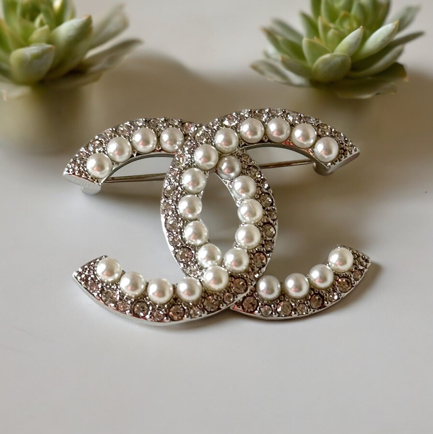 Chanel Silver Double C Brooch With Pearls & Crystals PinClassic , Clean Lines , minimalistic , elegant yet updated on trend Purchased at an Estate Sale Silver Double C with (faux) gorgeous pearls and clear crystals . In Like New Condition Free from dings My Mama Found What 