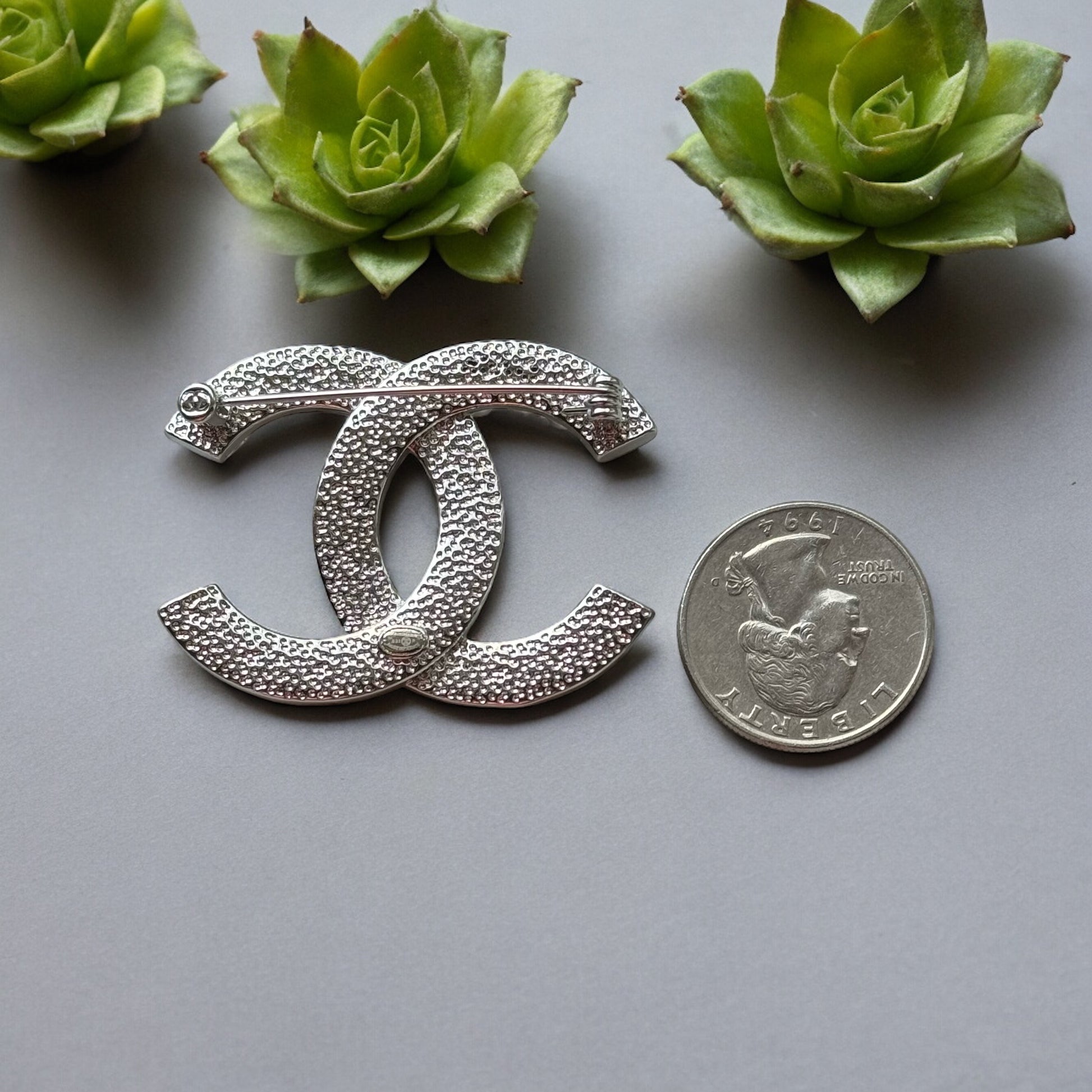 Chanel Silver Double C Brooch With Pearls & Crystals PinClassic , Clean Lines , minimalistic , elegant yet updated on trend Purchased at an Estate Sale Silver Double C with (faux) gorgeous pearls and clear crystals . In Like New Condition Free from dings