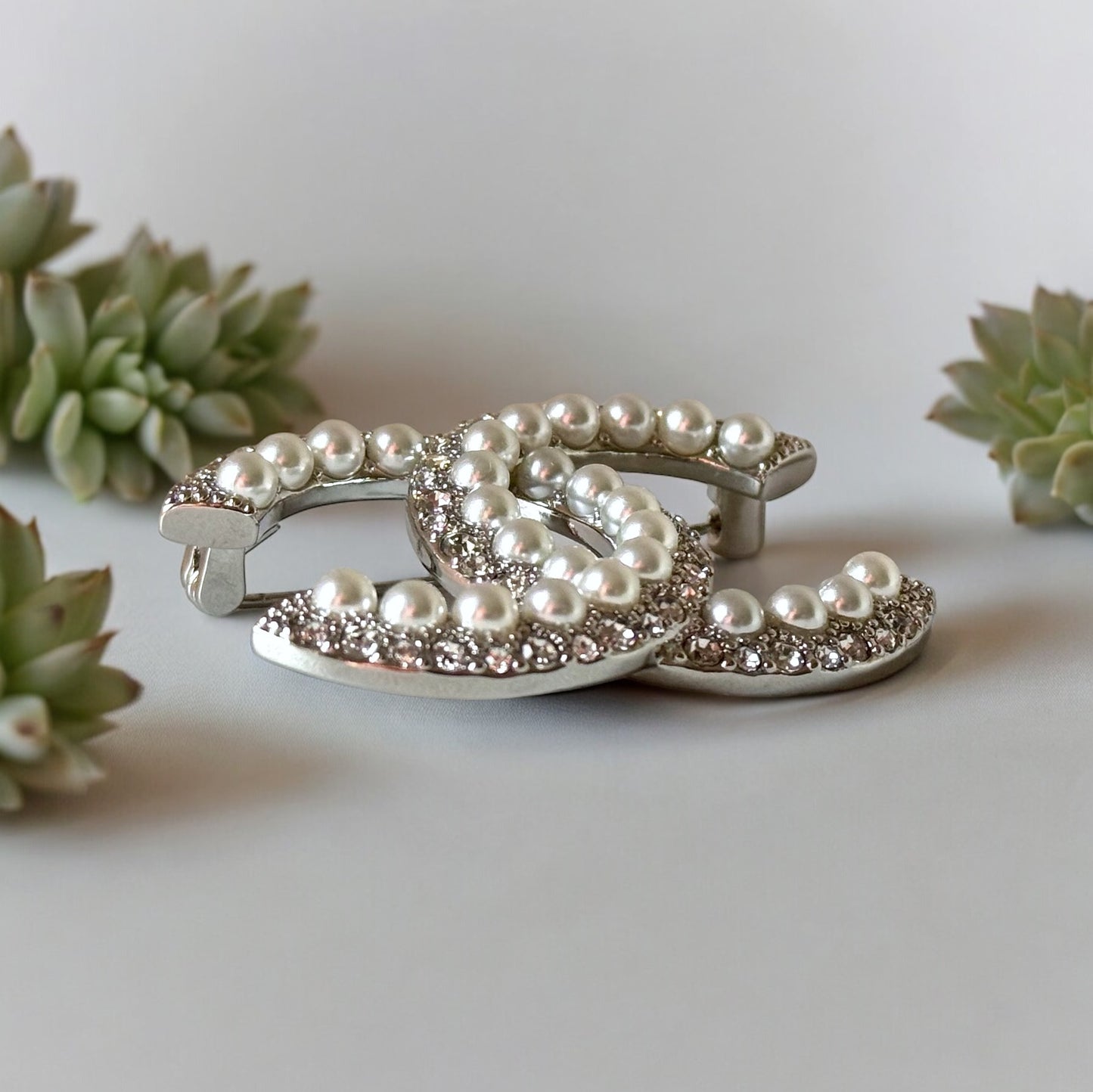 Chanel Silver Double C Brooch With Pearls & Crystals PinClassic , Clean Lines , minimalistic , elegant yet updated on trend Purchased at an Estate Sale Silver Double C with (faux) gorgeous pearls and clear crystals . In Like New Condition Free from dings My Mama Found What 