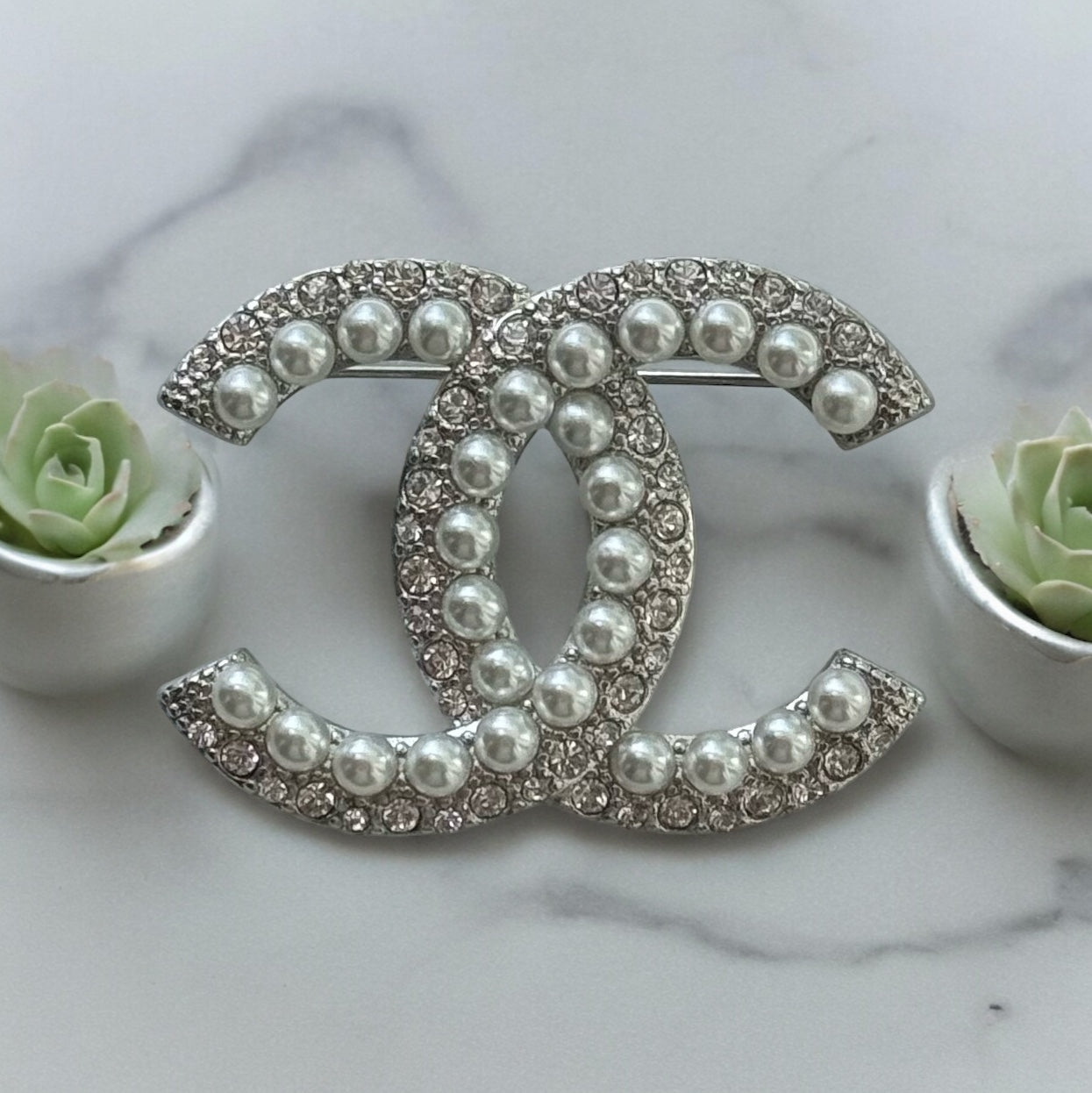 Chanel Silver Double C Brooch With Pearls & Crystals PinClassic , Clean Lines , minimalistic , elegant yet updated on trend Purchased at an Estate Sale Silver Double C with (faux) gorgeous pearls and clear crystals . In Like New Condition Free from dings My Mama Found What 