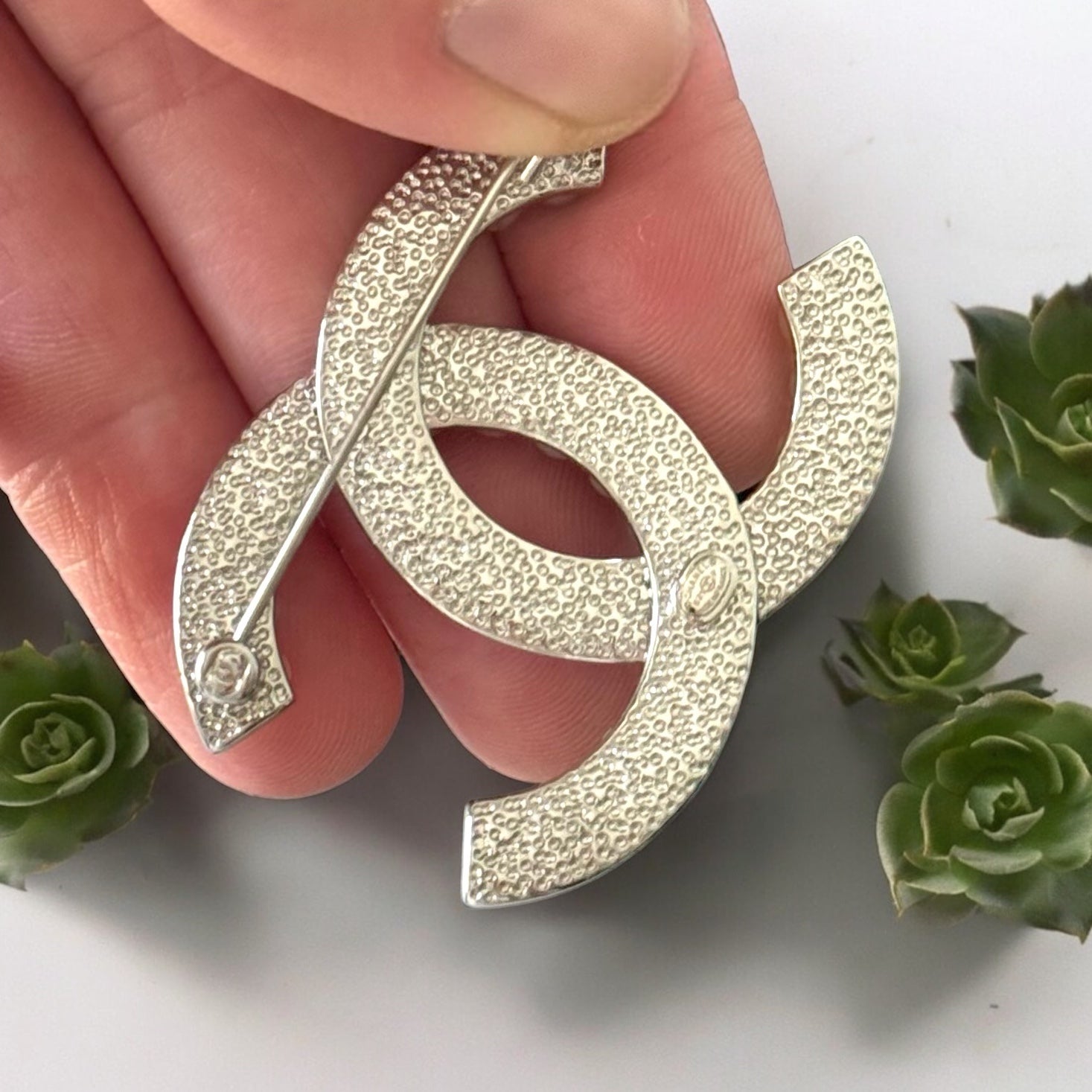 Chanel Silver Double C Brooch With Pearls & Crystals PinClassic , Clean Lines , minimalistic , elegant yet updated on trend Purchased at an Estate Sale Silver Double C with (faux) gorgeous pearls and clear crystals . In Like New Condition Free from dings