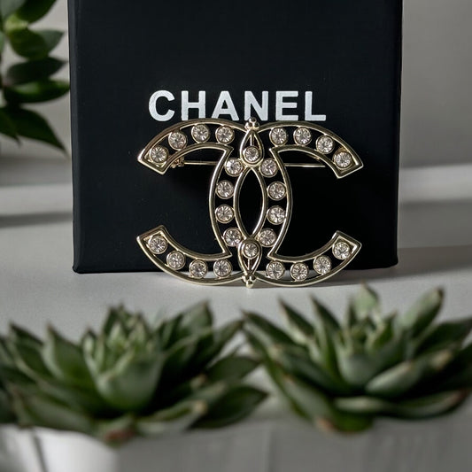 Chanel Strass Double C Cut Out with Clear Crystals Brooch Pin B23 ATransform any outfit into a statement piece with the Chanel Gold Double C brooch. Made in Italy, this brooch features bright clear crystals in Coco Chanel's signature cut-out design. Perfe My Mama Found What 