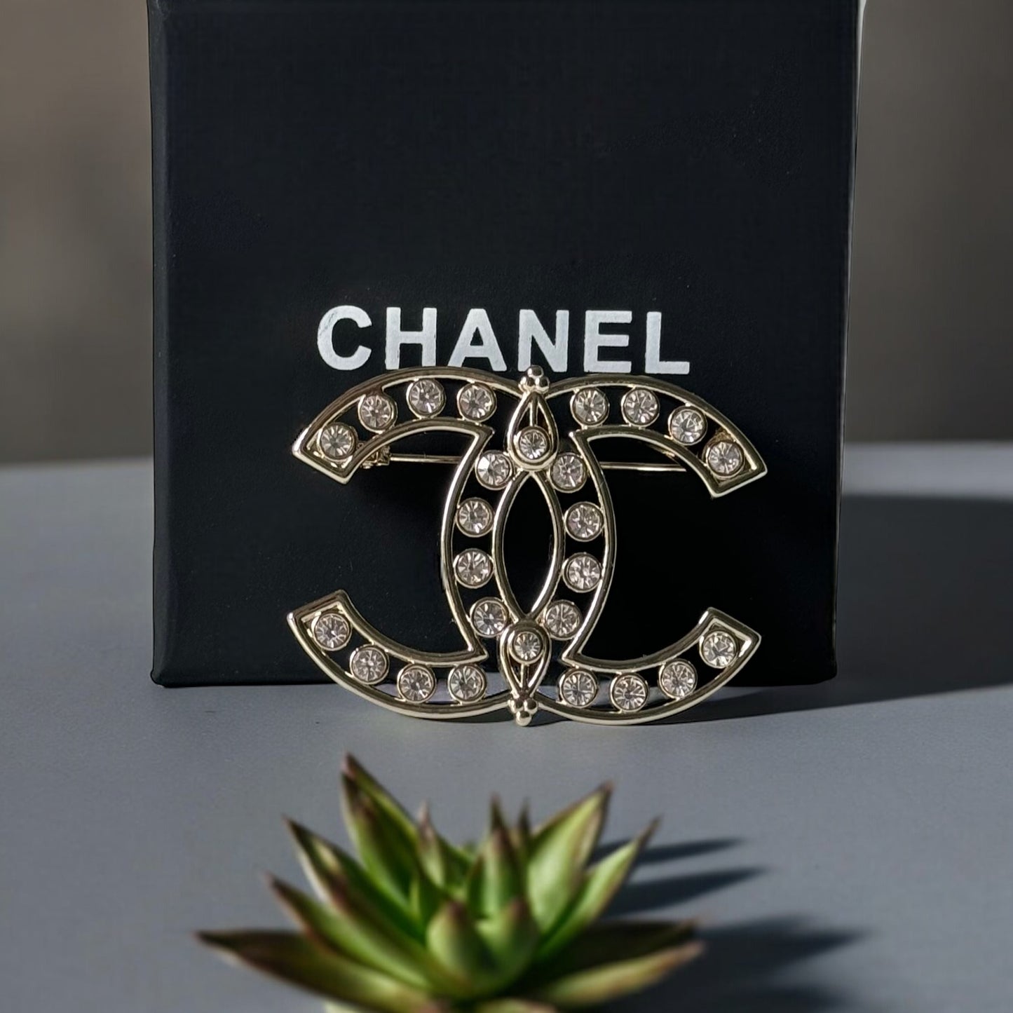 Chanel Strass Double C Cut Out with Clear Crystals Brooch Pin B23 ATransform any outfit into a statement piece with the Chanel Gold Double C brooch. Made in Italy, this brooch features bright clear crystals in Coco Chanel's signature cut-out design. Perfe My Mama Found What 