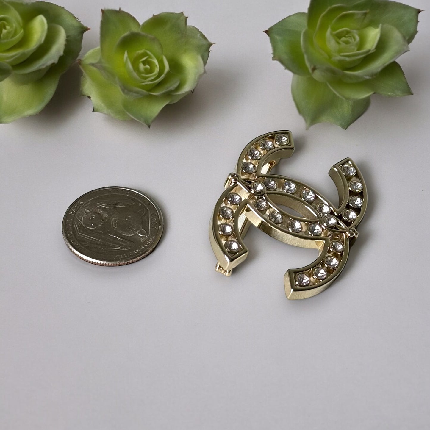 Chanel Strass Double C Cut Out with Clear Crystals Brooch Pin B23 ATransform any outfit into a statement piece with the Chanel Gold Double C brooch. Made in Italy, this brooch features bright clear crystals in Coco Chanel's signature cut-out design. Perfe My Mama Found What 