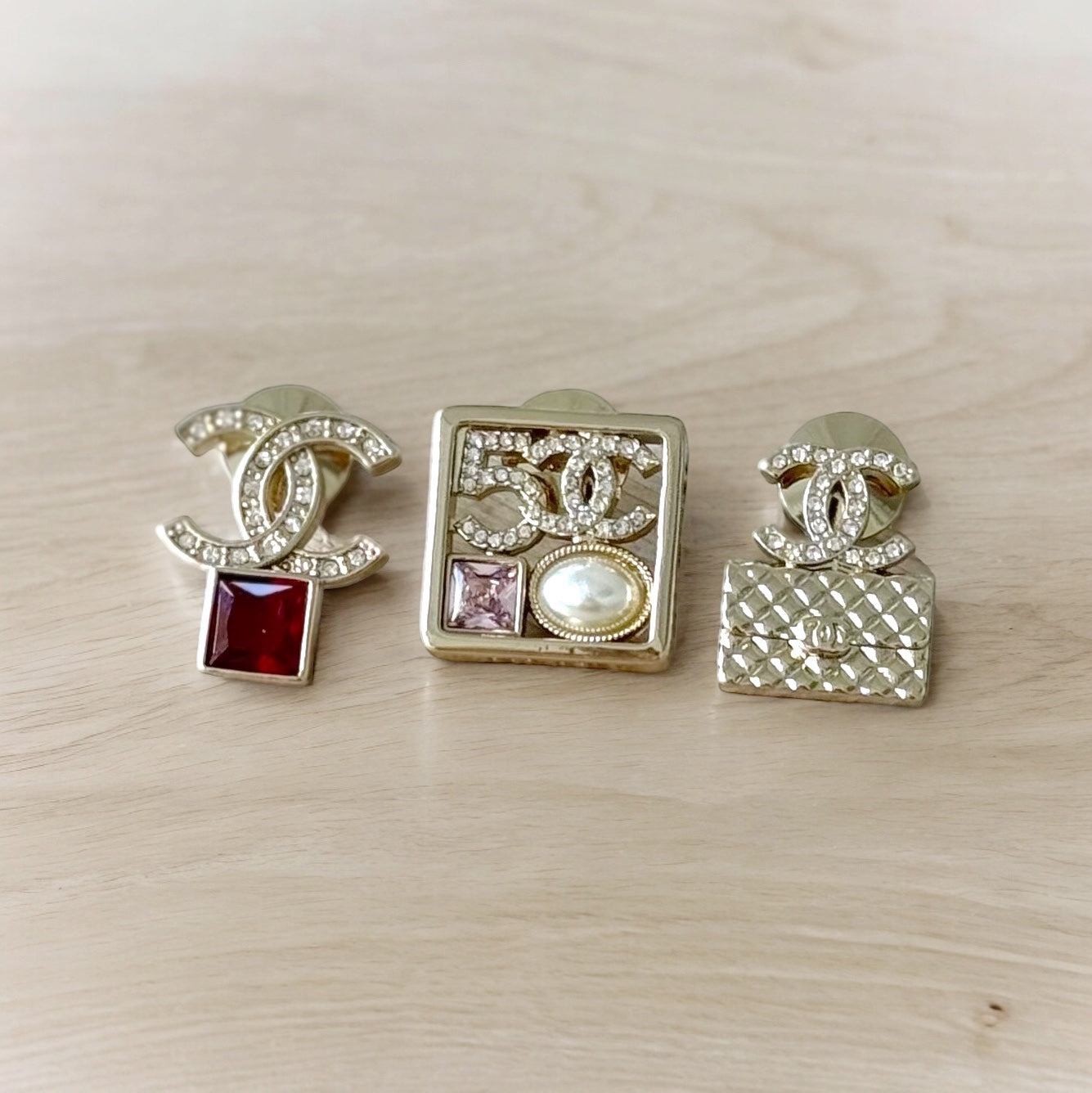 Chanel Strass Lighter Gold Set of 3 Crystal Encrusted Double C Cut Out Brooch PinsEmbrace daring style with this set of 3 Chanel brooch pins. Each one is uniquely designed, with crystal encrusted C-cutouts in a striking gold tone. Add these to any outfit My Mama Found What 