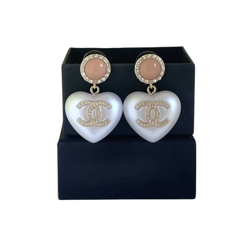 Rare Authentic Chanel CC Pink and White Heart Dangle Earrings Pre-Owned in elegant presentation box, showcasing unique design.