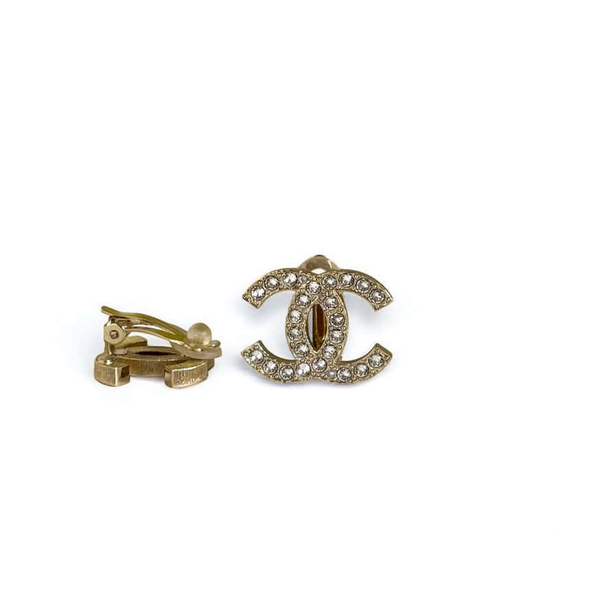 Authentic Chanel CC Lighter Gold Clip On Earrings with Crystals, pre-owned and in excellent condition.