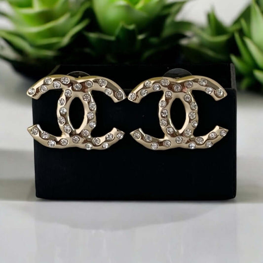 Chanel Gold CC earrings with crystals, luxury pre-owned statement piece in excellent condition.