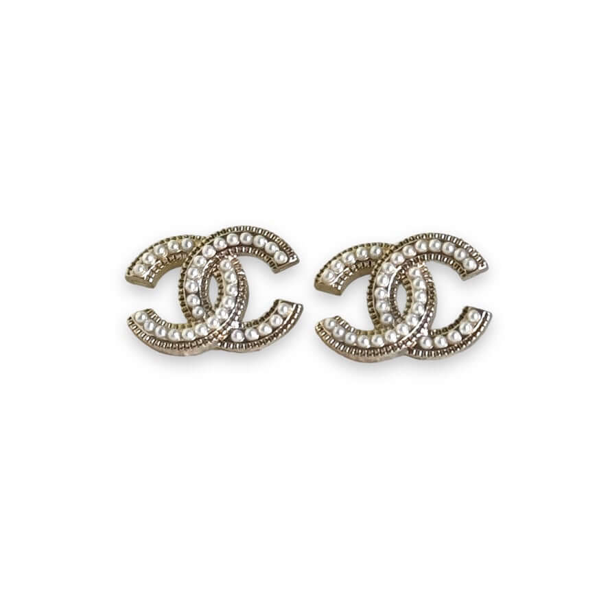 Chanel CC lighter gold tone post earrings encrusted with faux pearls, perfect for casual or dressier outfits, in like new condition.