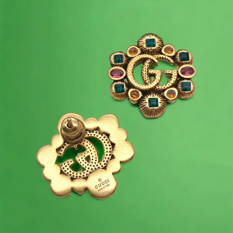 Gucci Stunning Antique Gold (ish) Tone with various colors & shapes crystals Post EarringsAdd some sparkle to your life with these Gucci Stunning Antique Gold (ish) Tone Post Earrings! Featuring the iconic Gucci Double G Marmont Line, these earrings are a