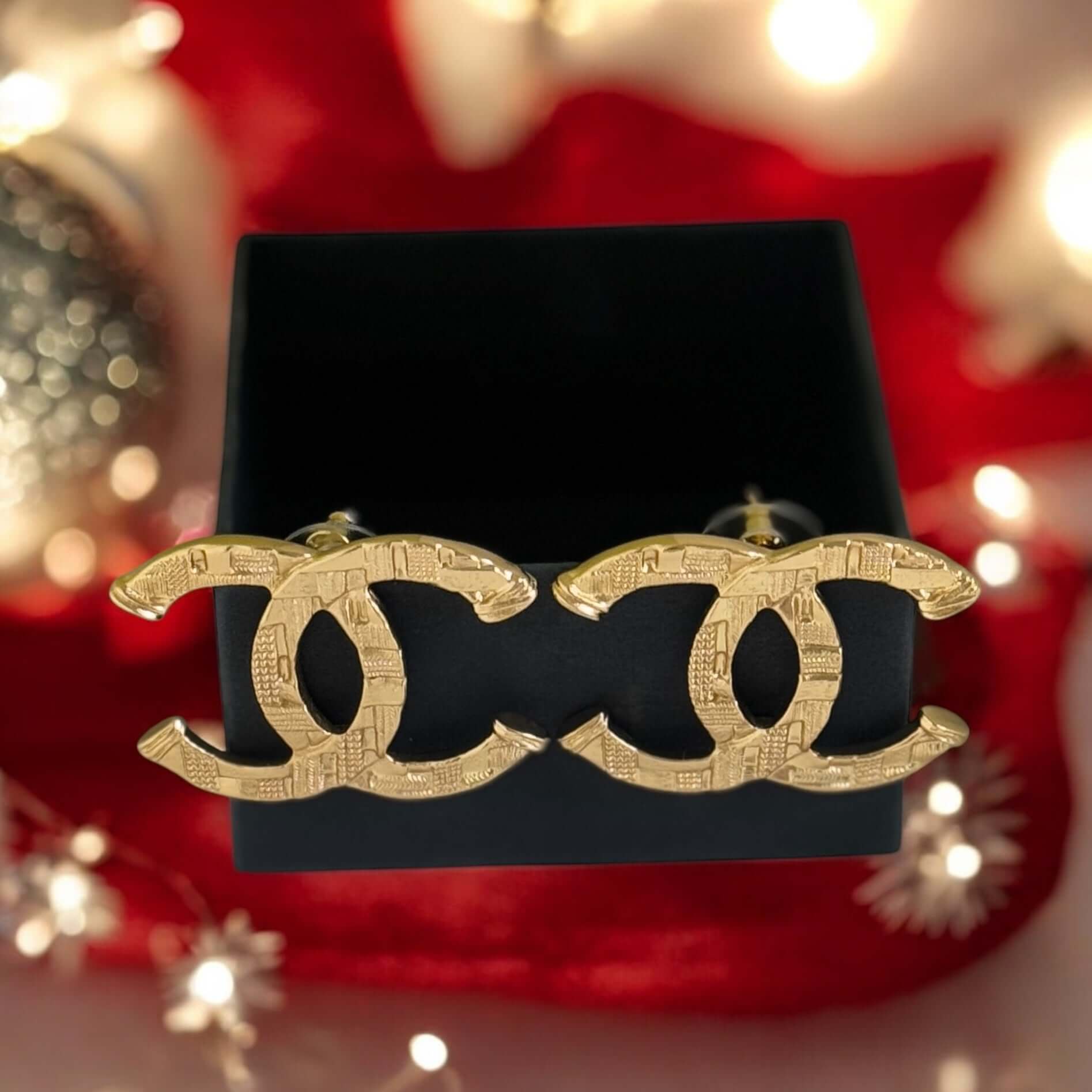 Authentic CHANEL Gold Textured CC Pre-Owned Earrings in original box, minimalistic design, perfect for a bold statement.