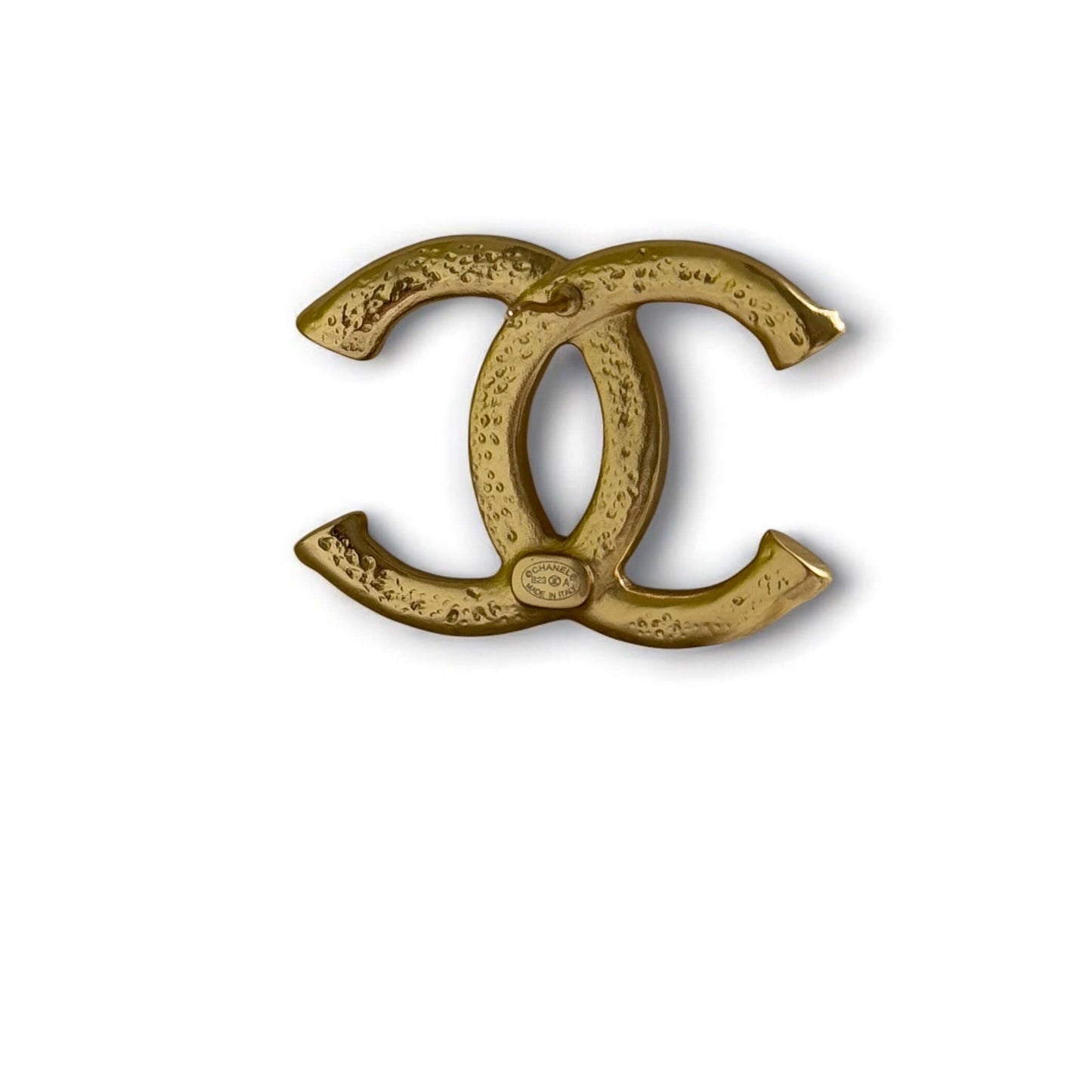 Authentic CHANEL Gold Textured CC Logo Brooch, bold design in like-new condition. Ideal for stylish statement pieces.