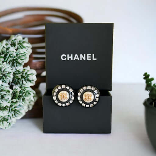 Chanel Gold Double C’s with crystals & Black Lucite Post EarringsPut a shine on your style with these Chanel Gold CC's earrings! bling eye-catching, these round earrings feature black lucite and a gold crystal centerEarringsMy Mama Found What