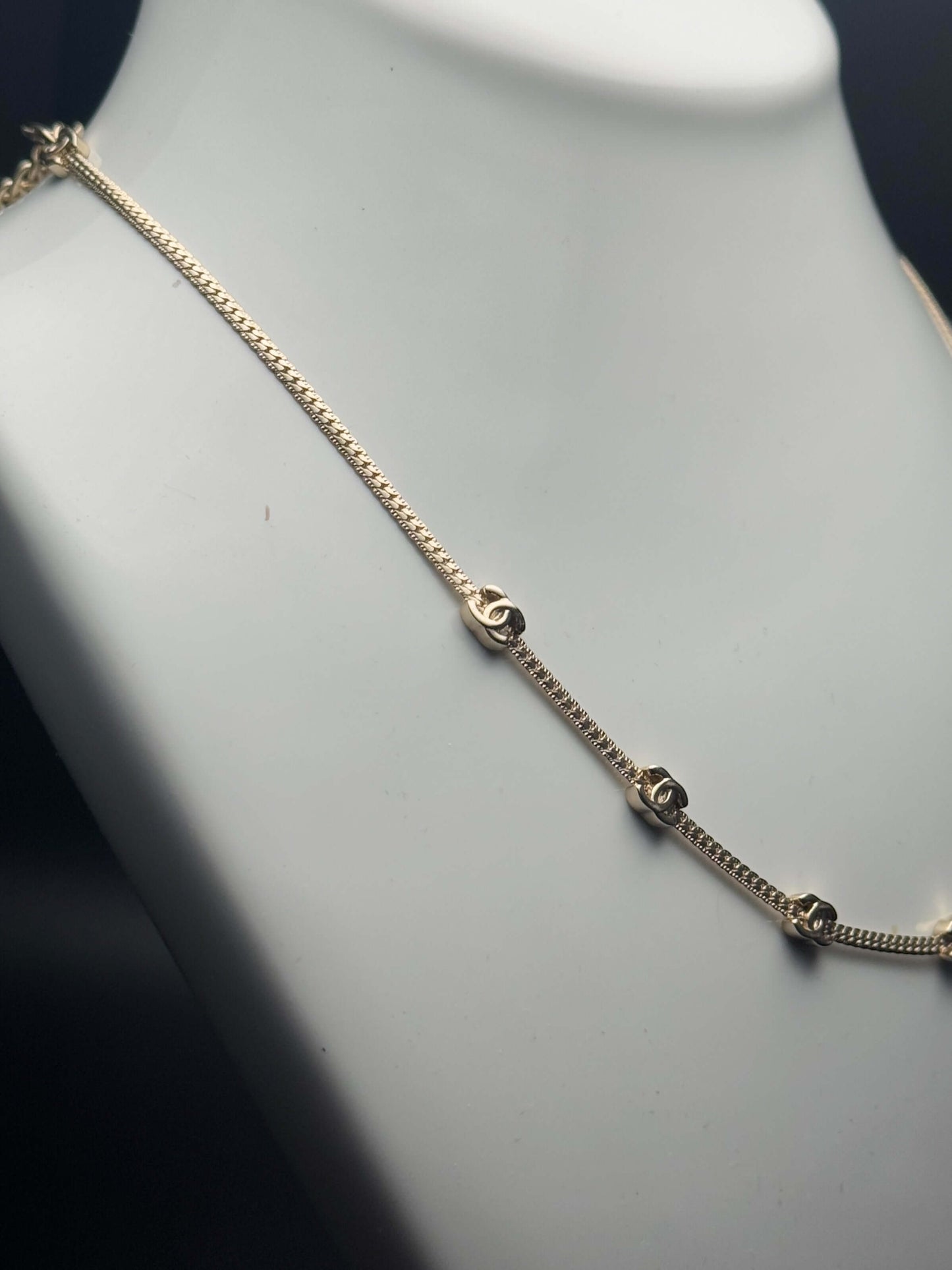 CHANEL CC Gold Plated Chain Necklace featuring mini CC details on an adjustable choker display. Pre-Owned luxury jewelry.