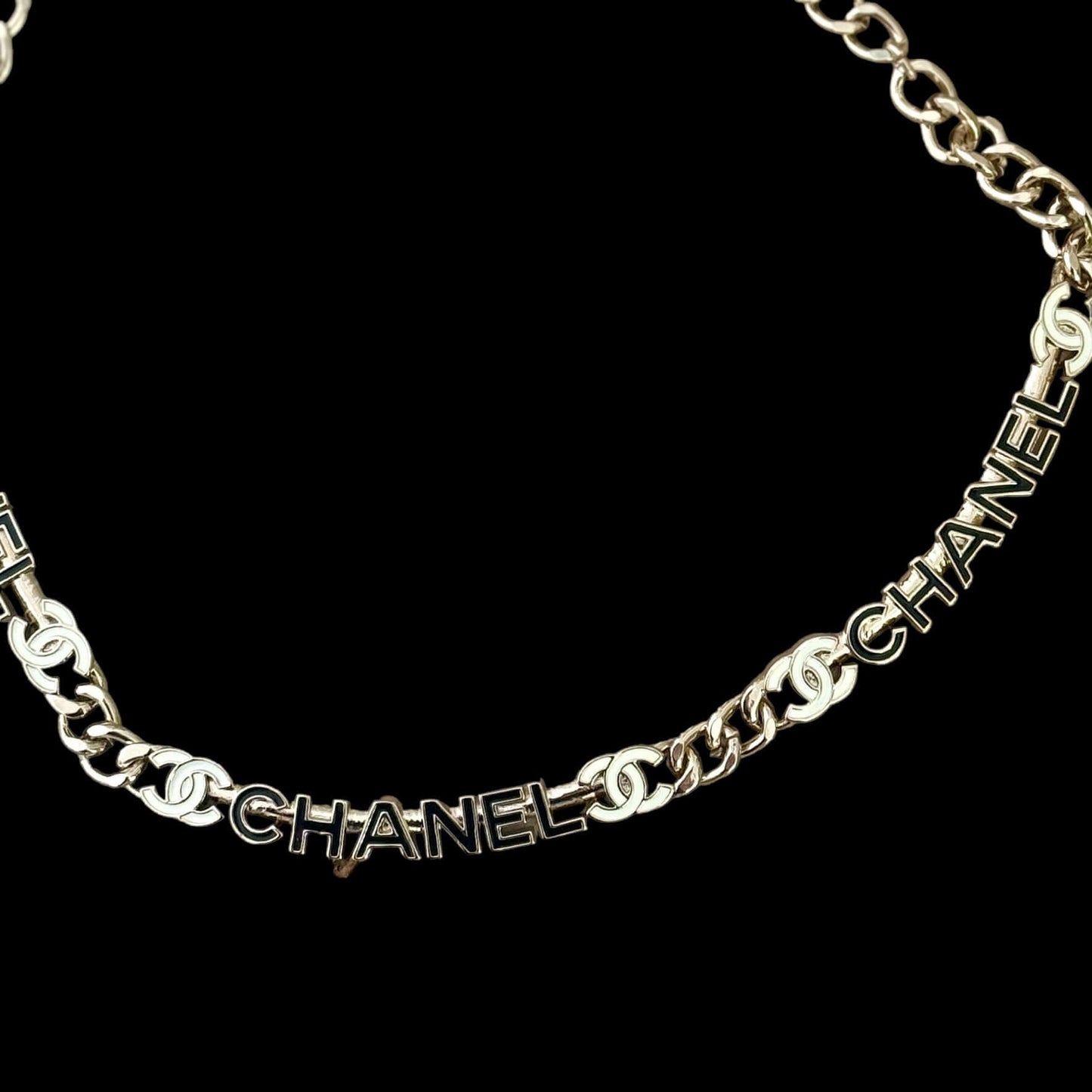 Chanel Strass Chain Adjustable Choker with black and white cut name pendants and gold chain, elegant black enamel petals, perfect luxury accessory.