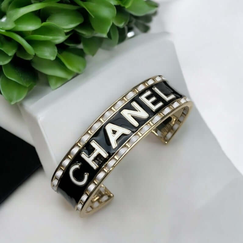 Authentic Chanel Mark Black White Enamel w/ white leather weaved throughout Cuff Pre-Owned