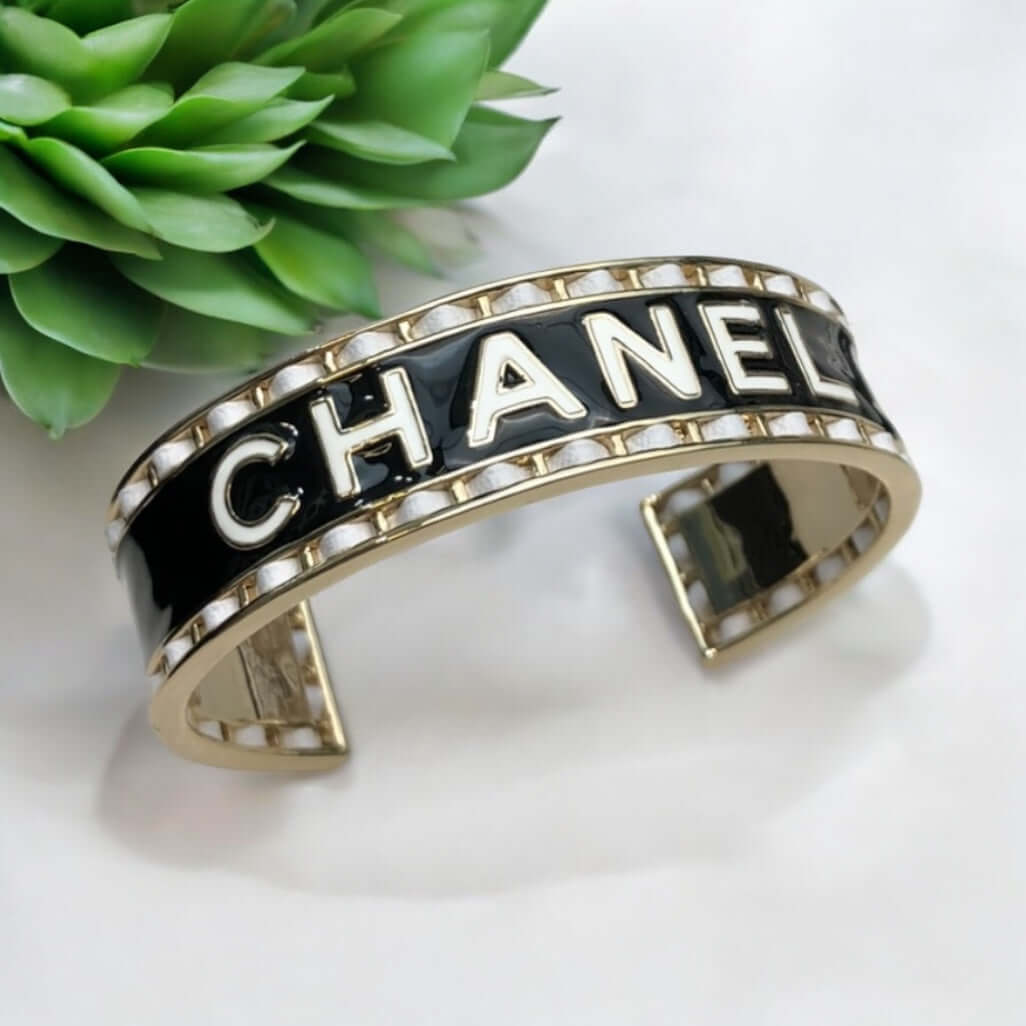 Authentic Chanel Mark Black White Enamel w/ white leather weaved throughout Cuff Pre-Owned