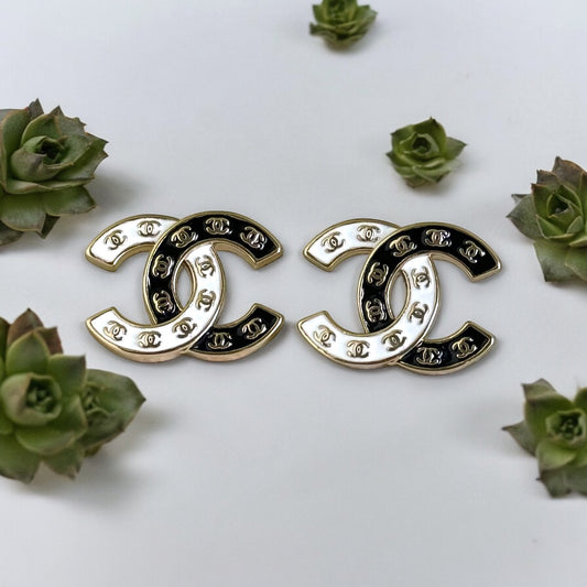 Chanel Gold Plated Double C with Black White Enamel with Mini Gold Double C’s Post EarringsLove these ! Love this season and style of Chanel ! Indulge in the epitome of luxury with these Chanel Gold Plated Double C earrings. The striking black and white e