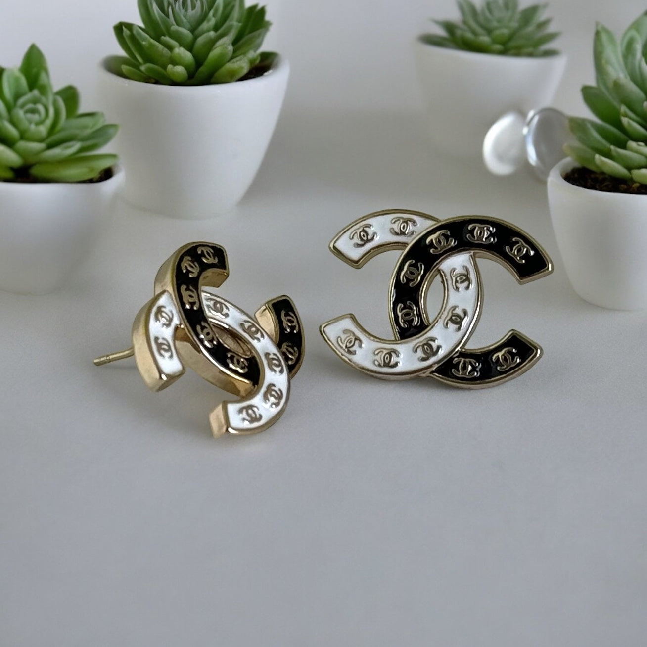 Chanel Gold Plated Double C with Black White Enamel with Mini Gold Double C’s Post EarringsLove these ! Love this season and style of Chanel ! Indulge in the epitome of luxury with these Chanel Gold Plated Double C earrings. The striking black and white e