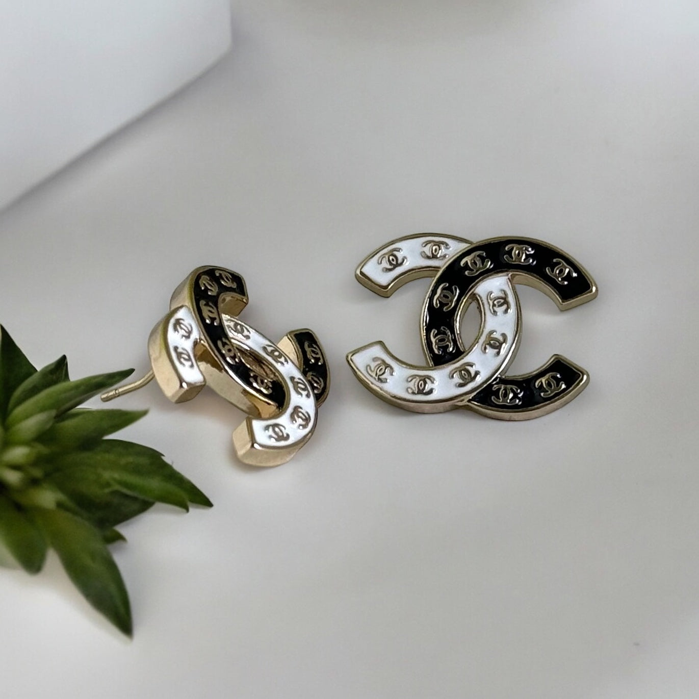 Chanel Gold Plated Double C with Black White Enamel with Mini Gold Double C’s Post EarringsLove these ! Love this season and style of Chanel ! Indulge in the epitome of luxury with these Chanel Gold Plated Double C earrings. The striking black and white e