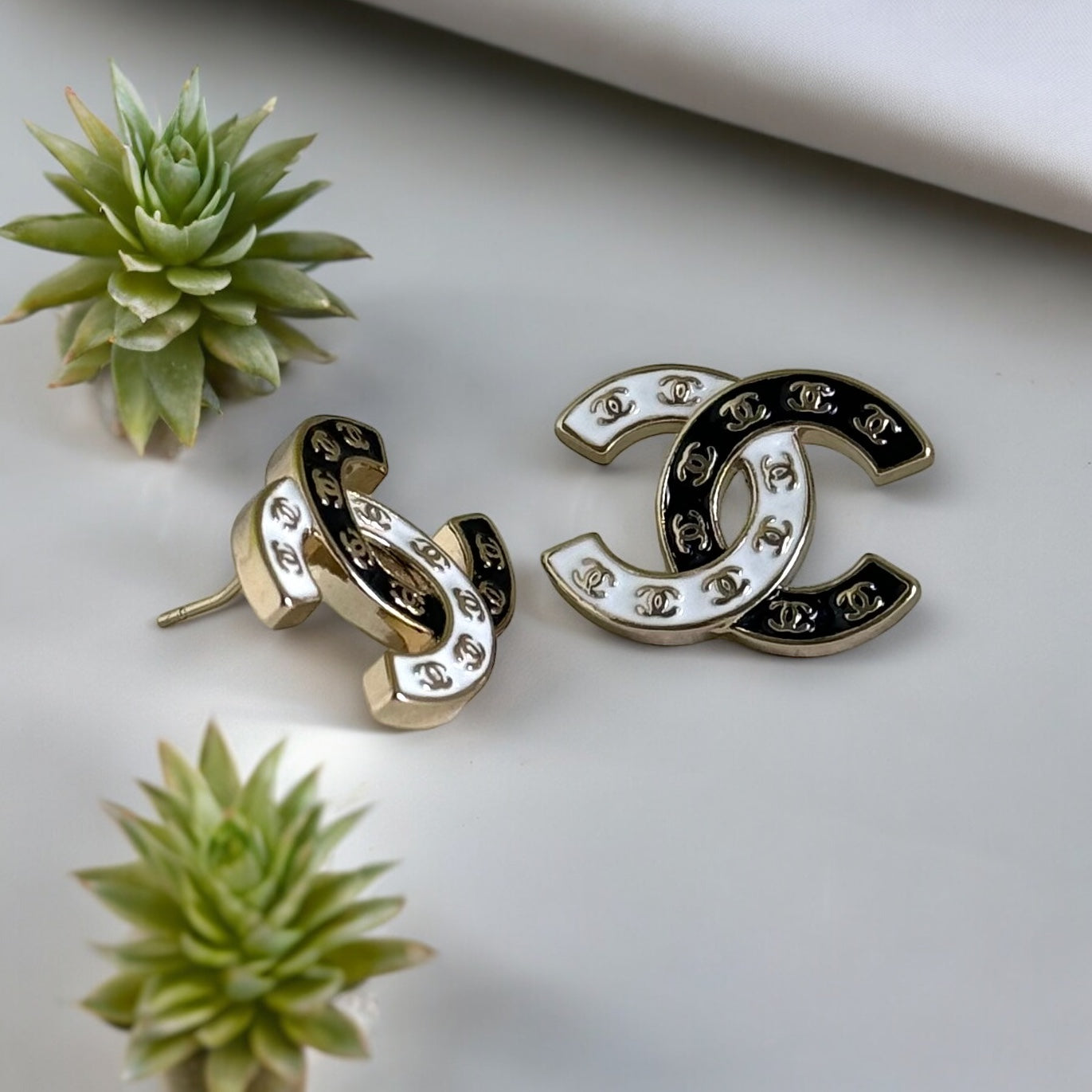 Chanel Gold Plated Double C with Black White Enamel with Mini Gold Double C’s Post EarringsLove these ! Love this season and style of Chanel ! Indulge in the epitome of luxury with these Chanel Gold Plated Double C earrings. The striking black and white e