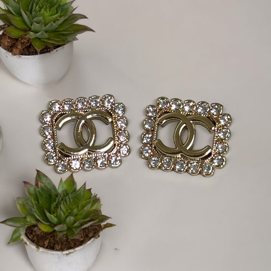 Chanel Gold Double C cut out with bright clear crystals post earringsAdd some timeless and classic bling to your wardrobe with these gorgeous Chanel Gold Double C earrings. Their bright clear crystals add just the right amount of sparkle to any outfit, ma