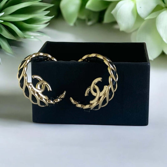 Authentic Chanel Gold CC Black Leather Statement Hoop Earrings in gift box, pre-owned, like new condition, elegant accessories.