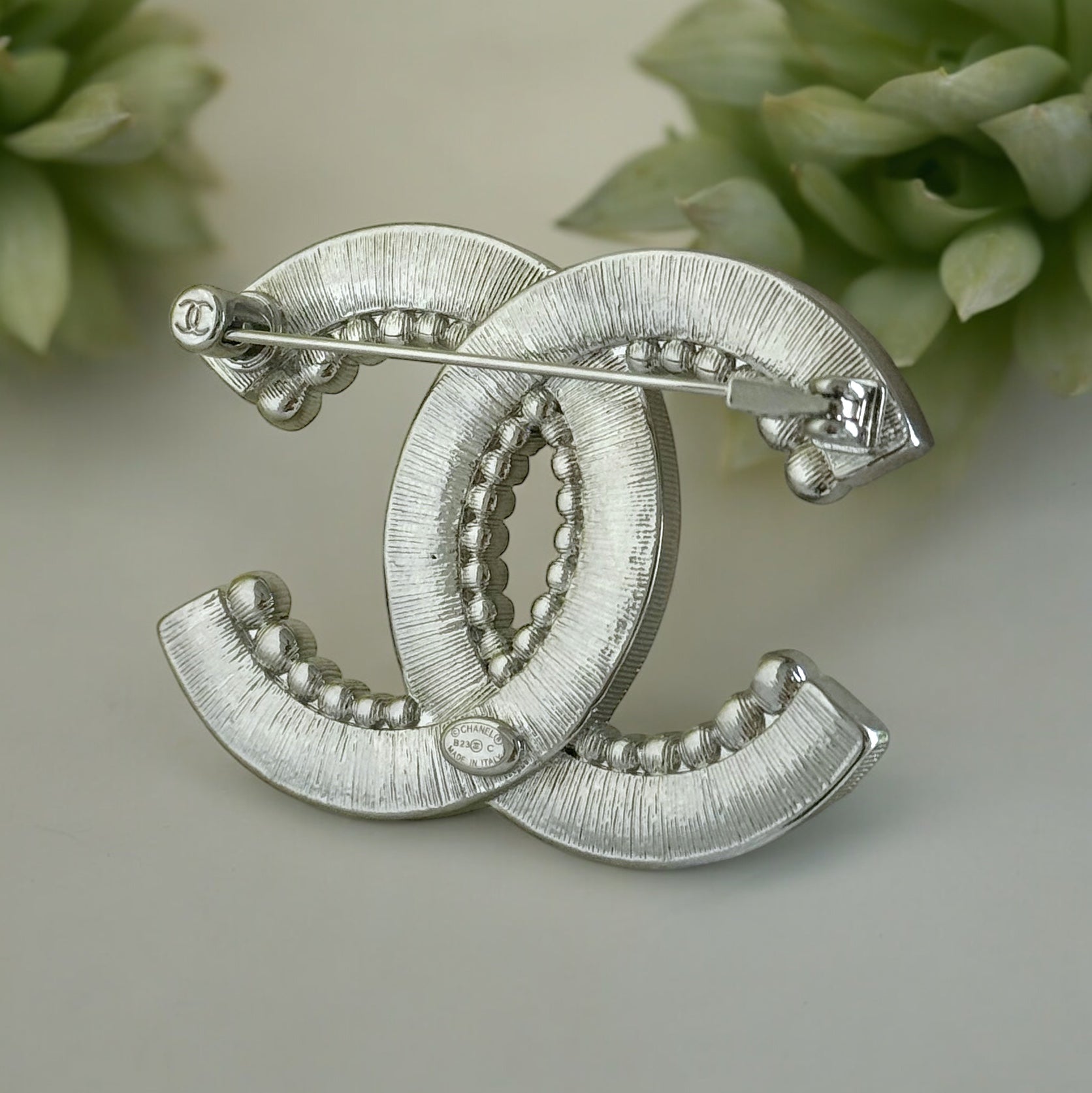 Chanel Silver Clear Crystals Double C Brooch PinAdd sparkle and style to any outfit with the Chanel Silver Clear Crystals Double C Brooch Pin. Perfect for special events, dinners, and nights out, this brooch is in excellent condition and comes with a gift