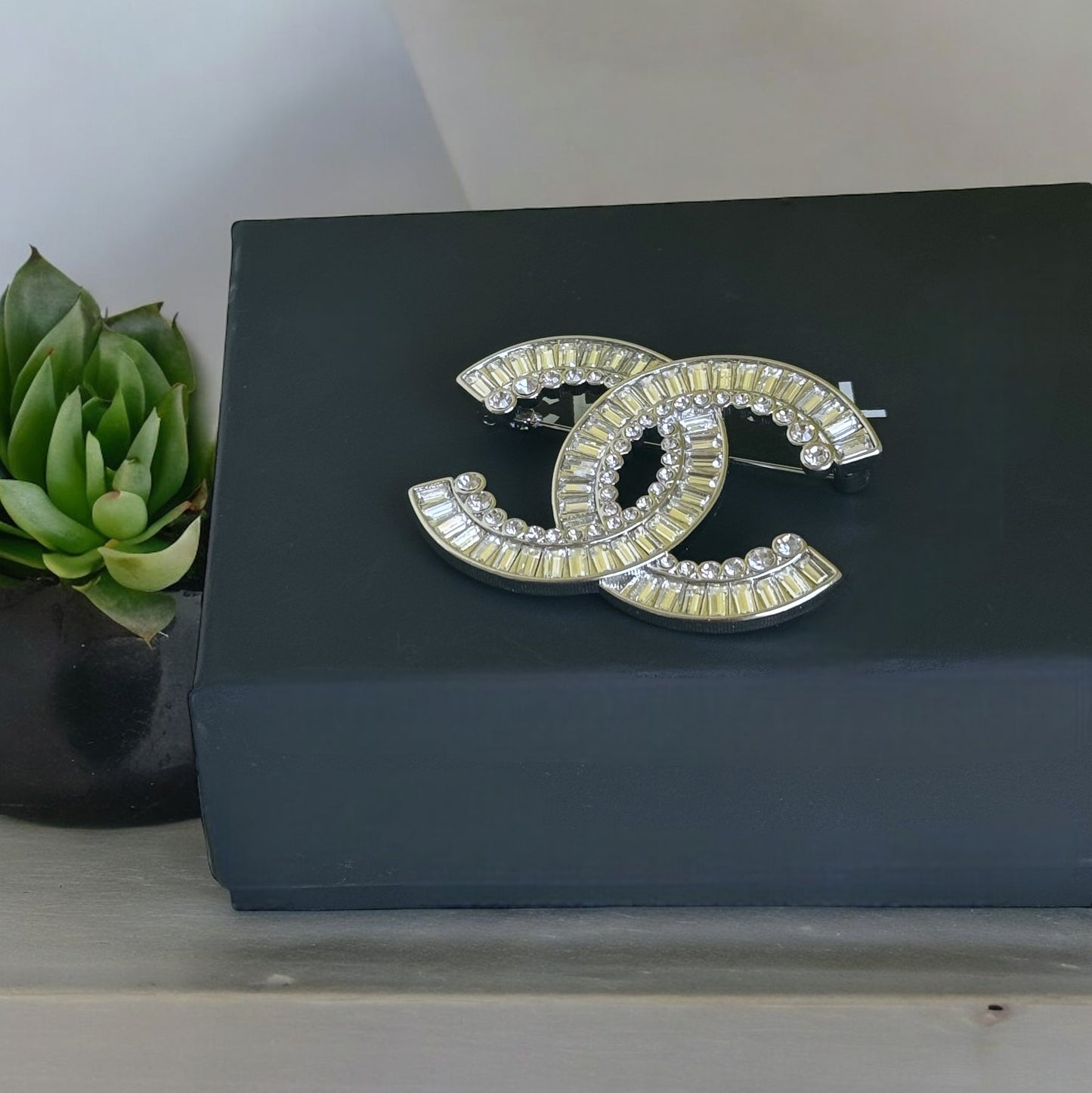 Chanel Silver Clear Crystals Double C Brooch PinAdd sparkle and style to any outfit with the Chanel Silver Clear Crystals Double C Brooch Pin. Perfect for special events, dinners, and nights out, this brooch is in excellent condition and comes with a gift