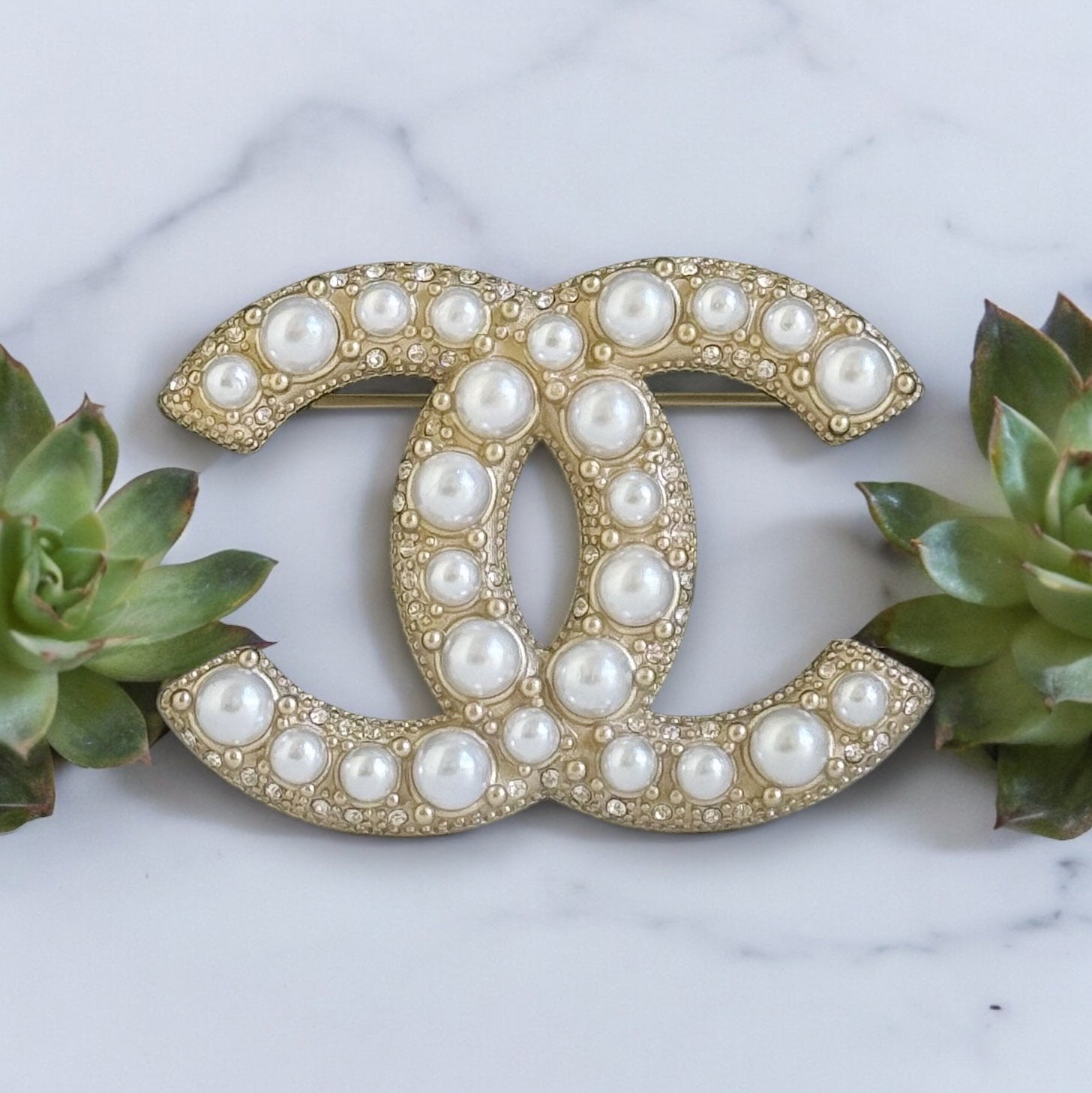 Chanel Gold Double C Brooch with Pearls accented with tiny crystalsGorgeous Made In France 14 B Lighter Gold Plated Faux Pearls & Mini crystals In excellent clean condition Free from dings or scratches Comes with the Chanel Gift Box & Bag Chanel Gold Doub