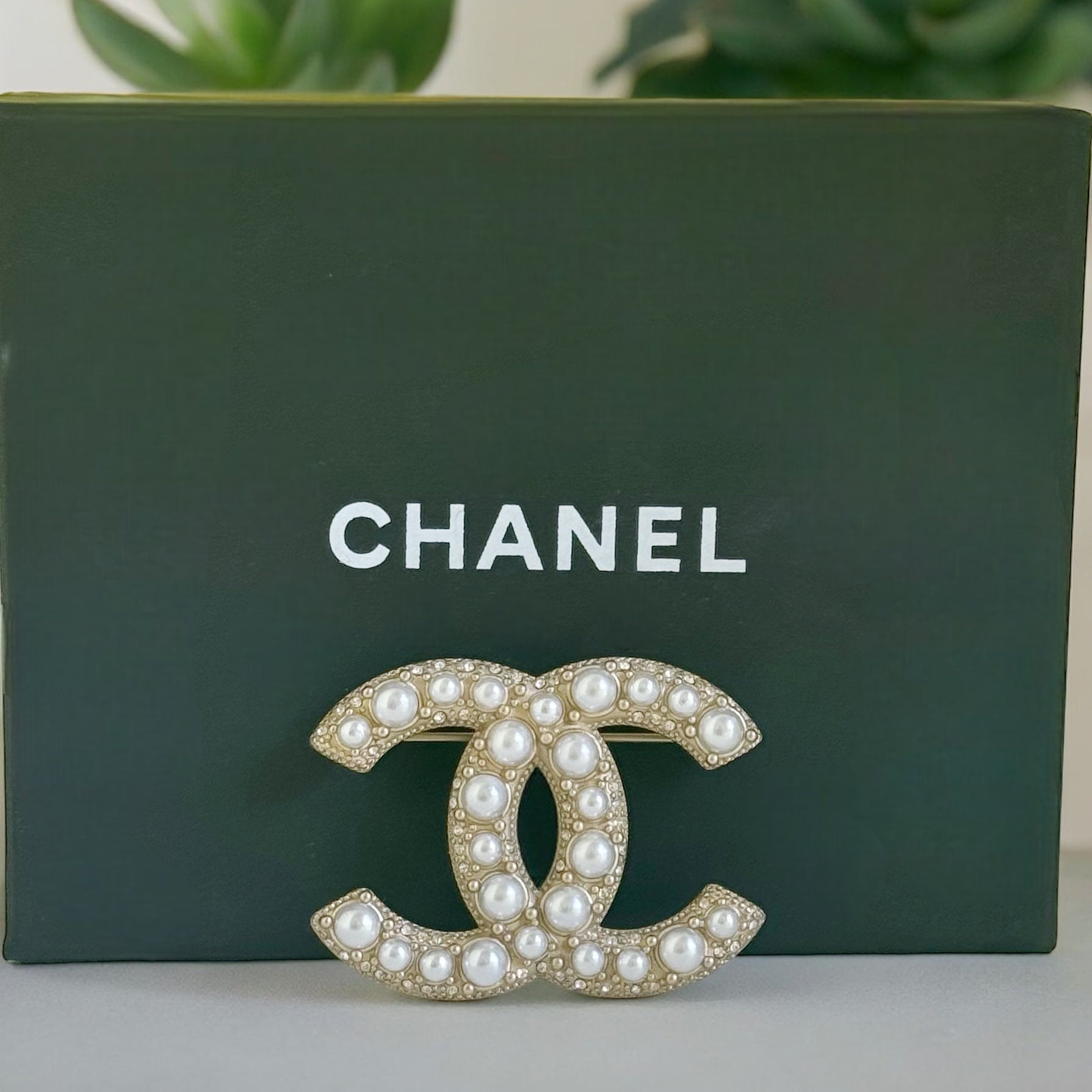 Chanel Gold Double C Brooch with Pearls accented with tiny crystalsGorgeous Made In France 14 B Lighter Gold Plated Faux Pearls & Mini crystals In excellent clean condition Free from dings or scratches Comes with the Chanel Gift Box & Bag Chanel Gold Doub