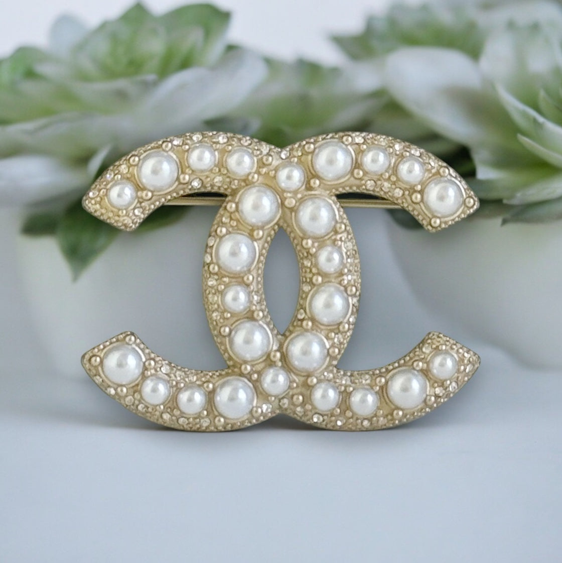 Chanel Gold Double C Brooch with Pearls accented with tiny crystalsGorgeous Made In France 14 B Lighter Gold Plated Faux Pearls & Mini crystals In excellent clean condition Free from dings or scratches Comes with the Chanel Gift Box & Bag Chanel Gold Doub