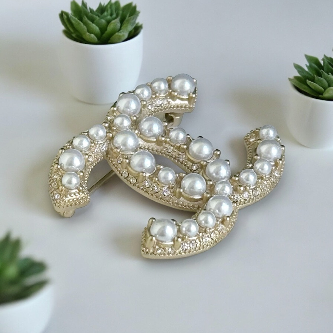 Chanel Gold Double C Brooch with Pearls accented with tiny crystalsGorgeous Made In France 14 B Lighter Gold Plated Faux Pearls & Mini crystals In excellent clean condition Free from dings or scratches Comes with the Chanel Gift Box & Bag Chanel Gold Doub