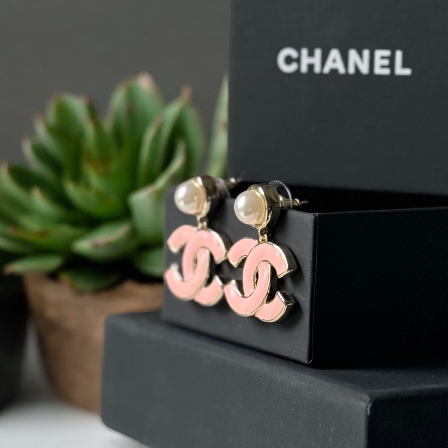 Chanel Lighter Gold Strass Pearl Post with Bigger Pink Enamel Double C Dangle EarringsAdd some playful CoCo Chanel style to your look with these gorgeous earrings! These earrings are a statement piece that will never go out of style. Made in Italy, they f