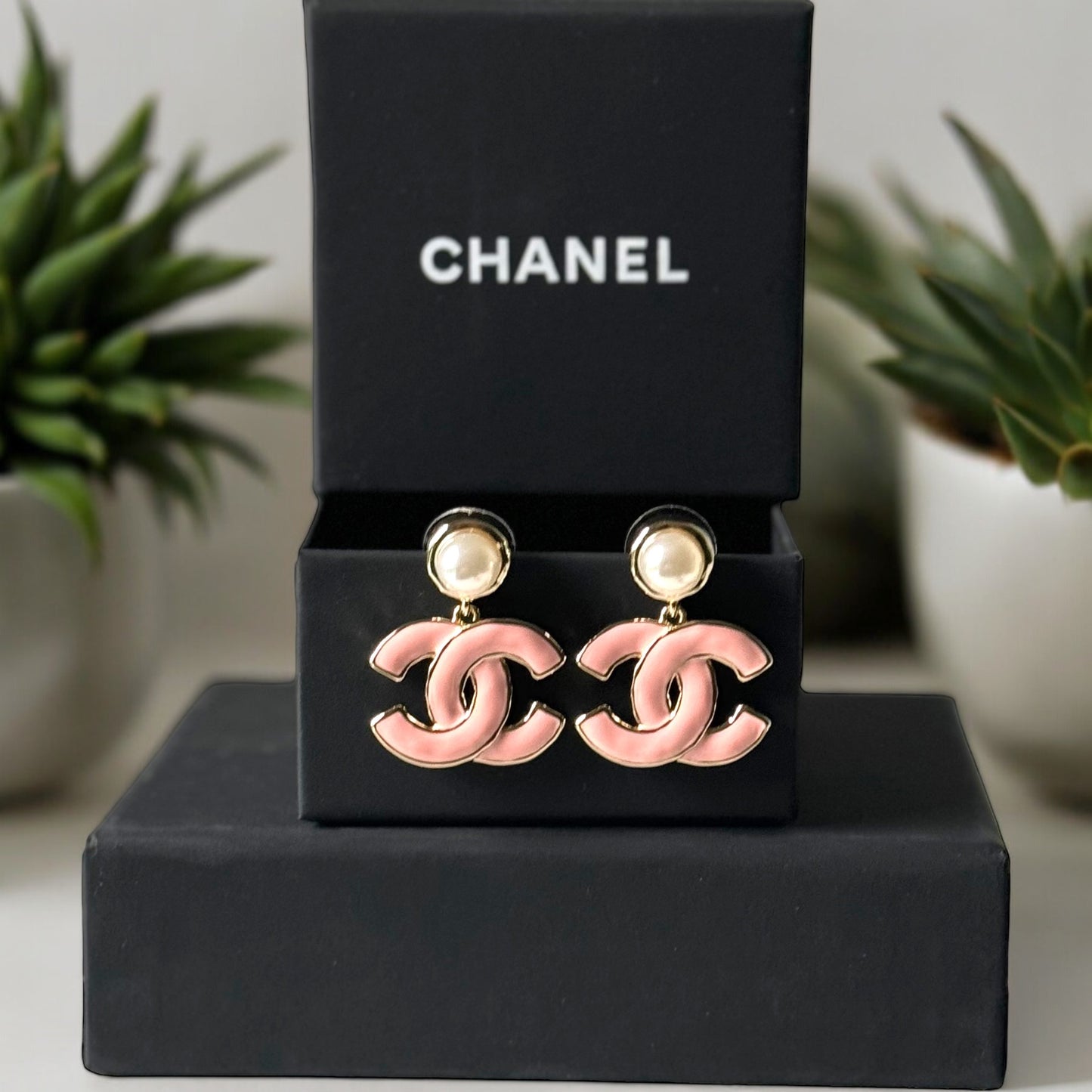 Chanel Lighter Gold Strass Pearl Post with Bigger Pink Enamel Double C Dangle EarringsAdd some playful CoCo Chanel style to your look with these gorgeous earrings! These earrings are a statement piece that will never go out of style. Made in Italy, they f