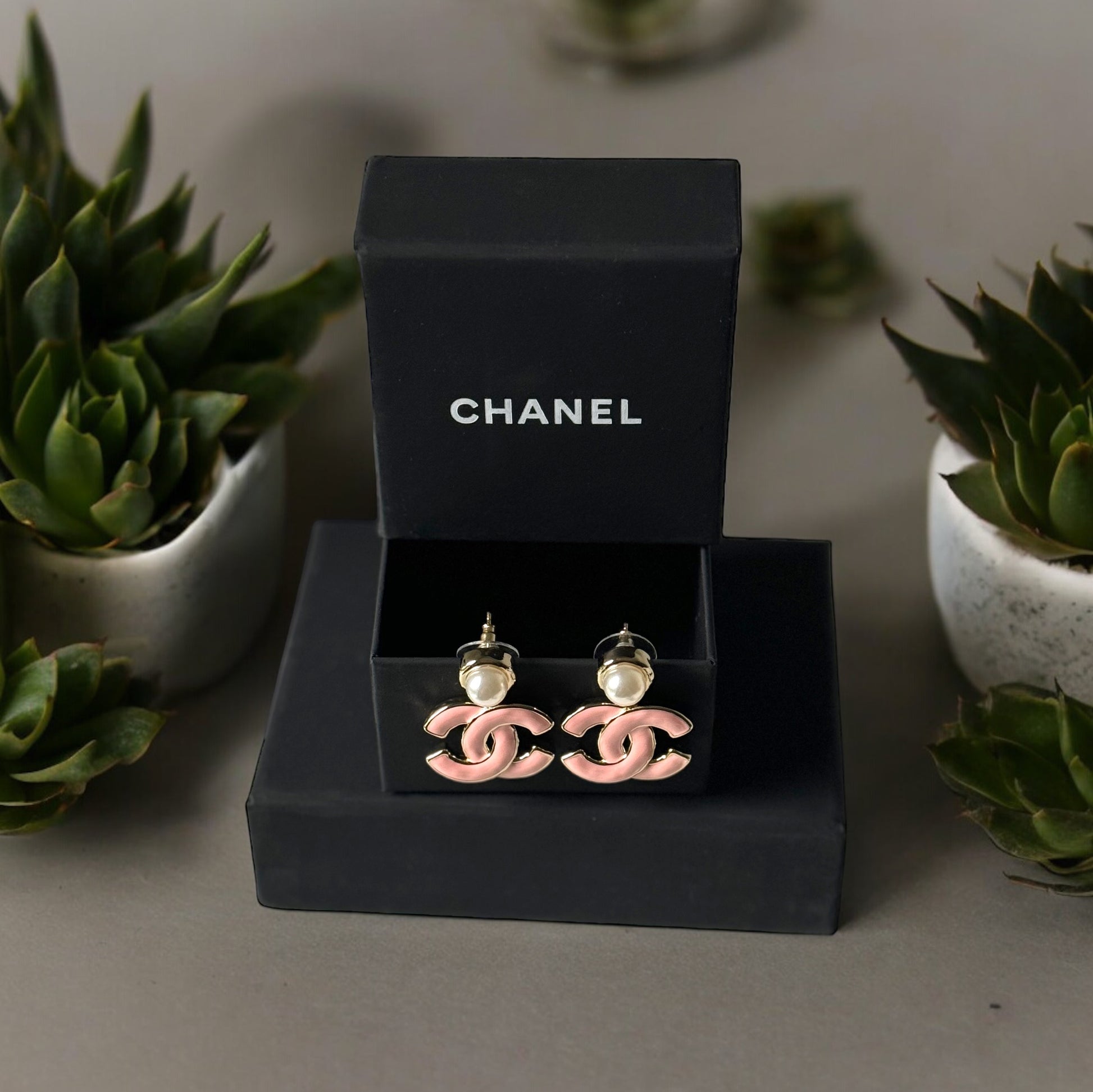 Chanel Lighter Gold Strass Pearl Post with Bigger Pink Enamel Double C Dangle EarringsAdd some playful CoCo Chanel style to your look with these gorgeous earrings! These earrings are a statement piece that will never go out of style. Made in Italy, they f