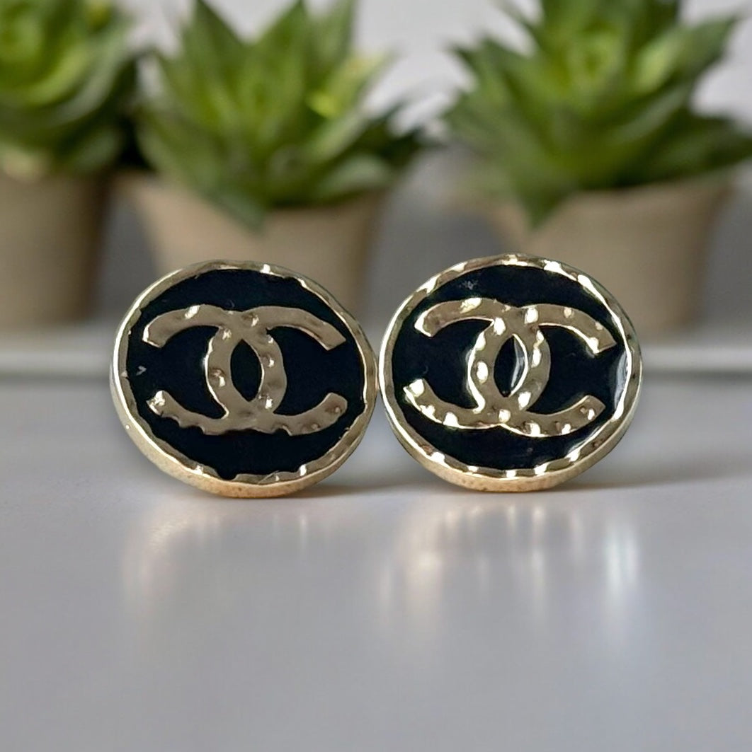 Chanel Round Gold Gold Double C Textured Black Enamel Post EarringsGorgeous ! New Never Worn Chanel Round Gold Gold Double C Textured Black Enamel Post Earrings On Consignment - The consignor said she has never worn these they were given to her as a gift