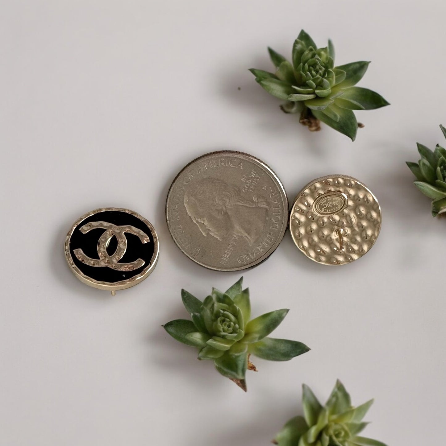 Chanel Gold Double C Textured Black Enamel Round Earrings 24 C Made in ItalyElevate any outfit with Chanel's iconic Gold Double C Textured Black Enamel Earrings. Made in Italy with a stunning minimal texture and smooth black enamel, these round post earri