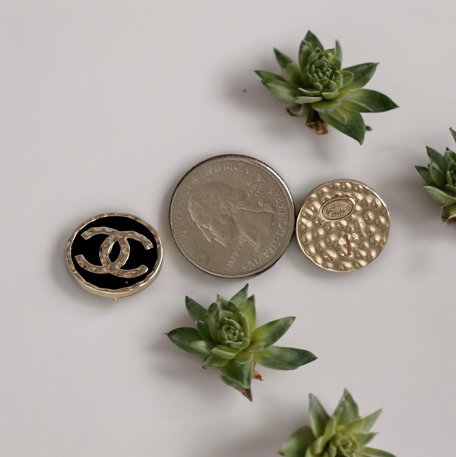 Chanel Gold Double C Textured Black Enamel Round Earrings 24 C Made in ItalyElevate any outfit with Chanel's iconic Gold Double C Textured Black Enamel Earrings. Made in Italy with a stunning minimal texture and smooth black enamel, these round post earri