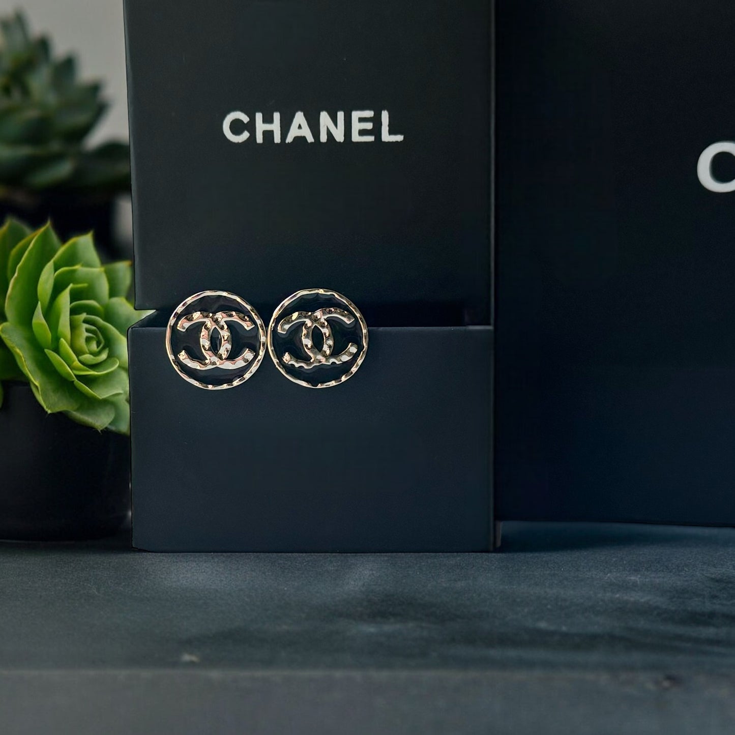 Chanel Round Gold Gold Double C Textured Black Enamel Post EarringsGorgeous ! New Never Worn Chanel Round Gold Gold Double C Textured Black Enamel Post Earrings On Consignment - The consignor said she has never worn these they were given to her as a gift