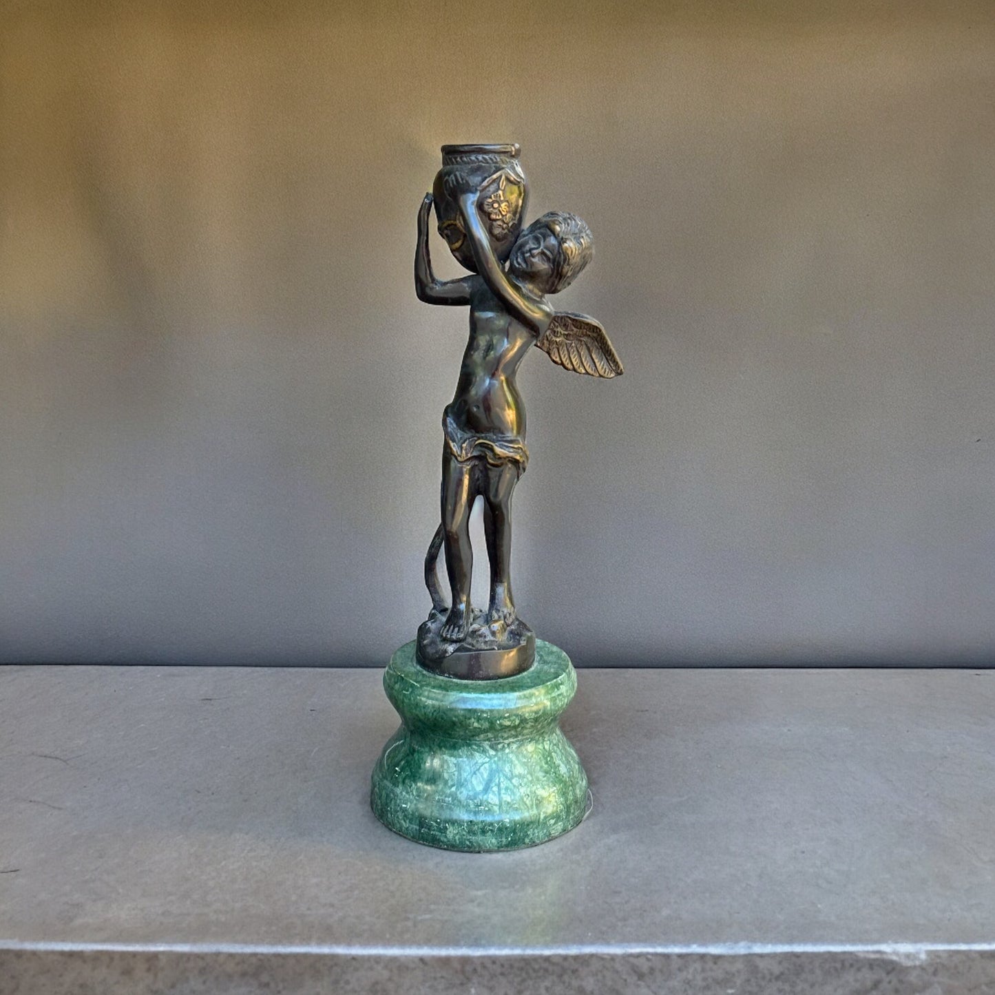 Bronze Cherub On Green Marble Vase Hand- crafted Collectible Florentine Statue Vintage /AntiqueIndulge in luxury with this one-of-a-kind collectible Florentine statue. Hand-crafted with intricate detail, the rich bronze cherub rests delicately on a green