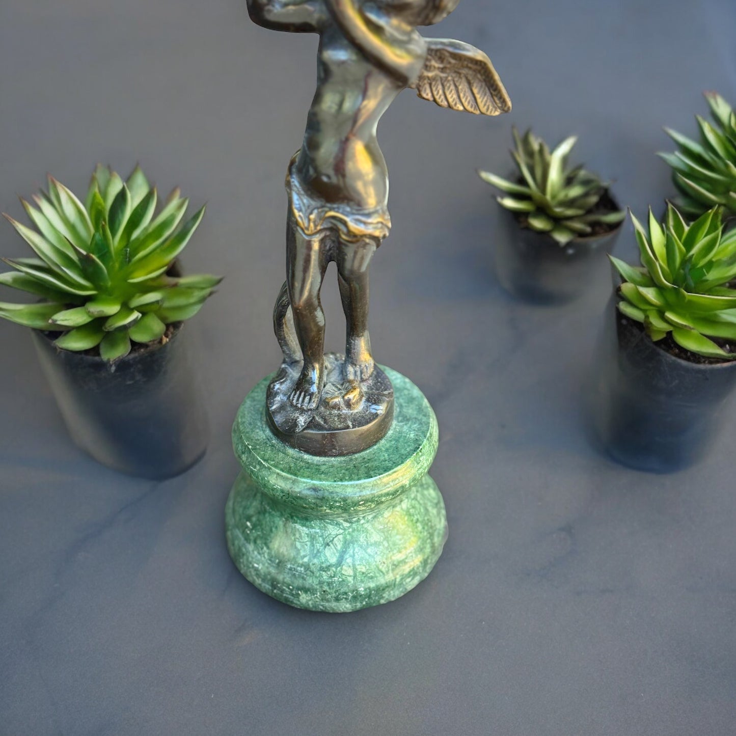 Bronze Cherub On Green Marble Vase Hand- crafted Collectible Florentine Statue Vintage /AntiqueIndulge in luxury with this one-of-a-kind collectible Florentine statue. Hand-crafted with intricate detail, the rich bronze cherub rests delicately on a green