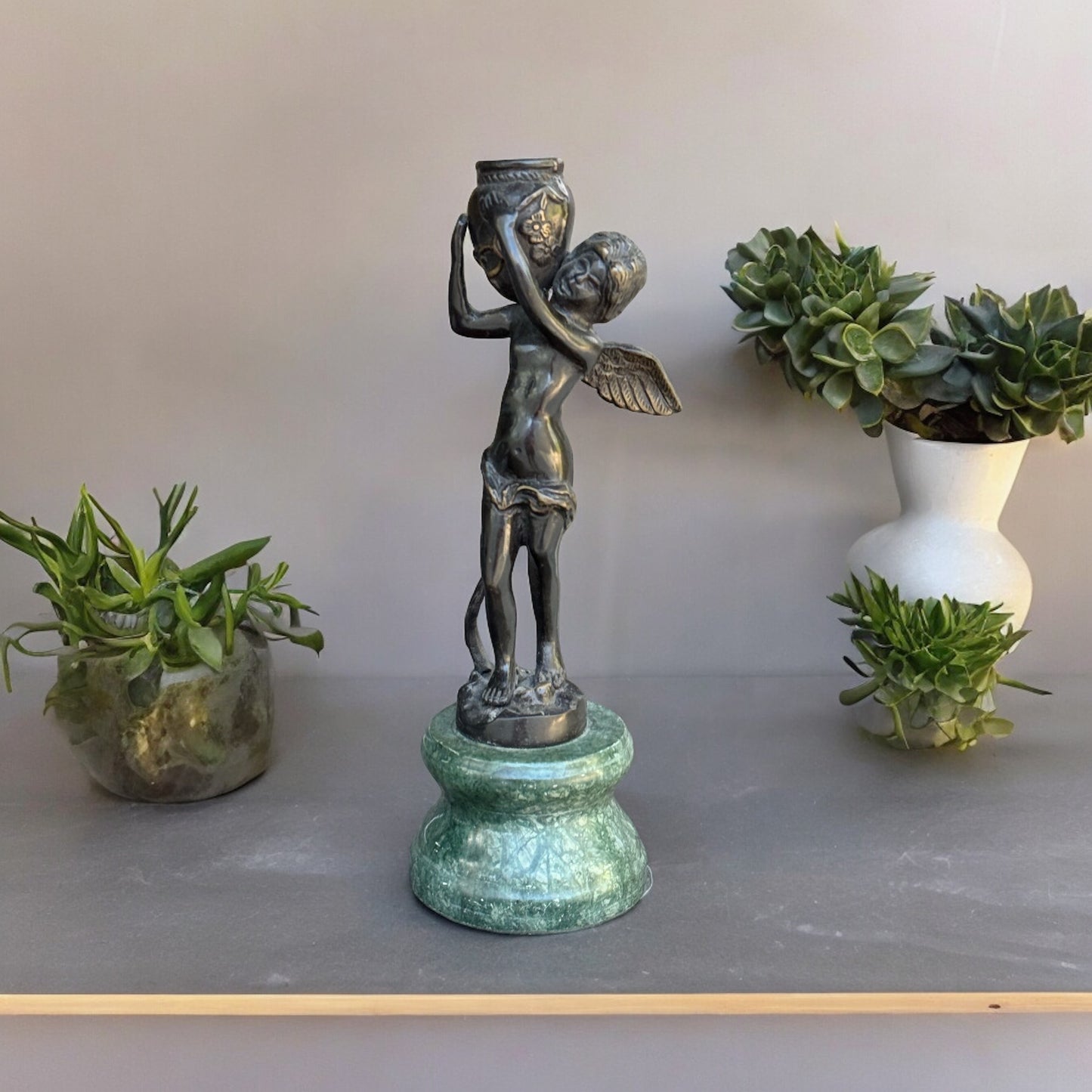 Bronze Cherub On Green Marble Vase Hand- crafted Collectible Florentine Statue Vintage /AntiqueIndulge in luxury with this one-of-a-kind collectible Florentine statue. Hand-crafted with intricate detail, the rich bronze cherub rests delicately on a green